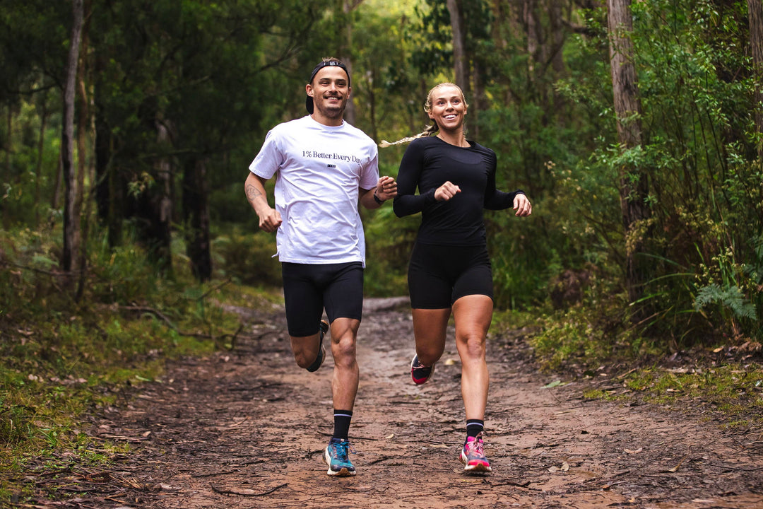 girl and boy running trails