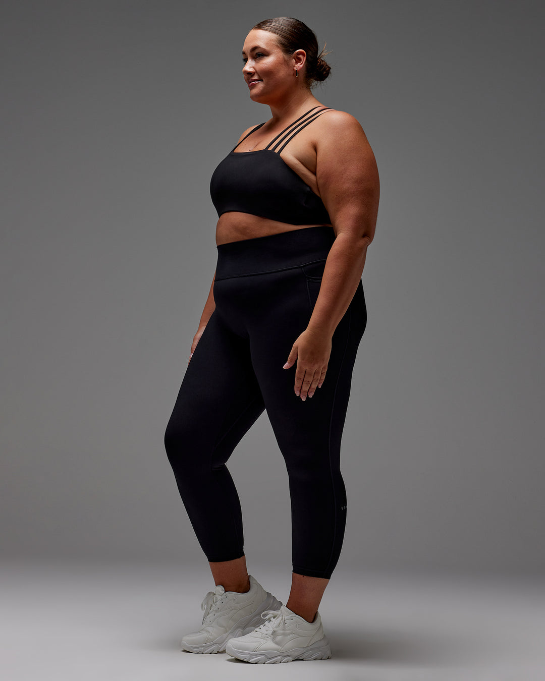 Woman wearing Fusion Ultra High-Rise 7/8 Legging Pockets - Black | Model:Jordie | Size:2XL