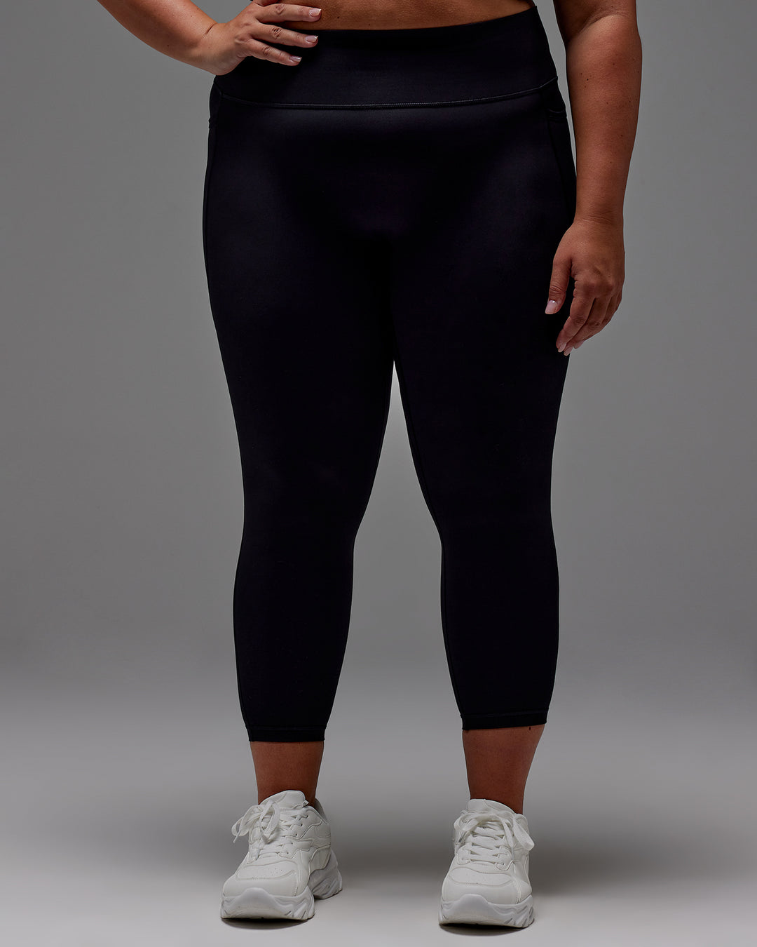 Woman wearing Fusion Ultra High-Rise 7/8 Legging Pockets - Black | Model:Jordie | Size:2XL