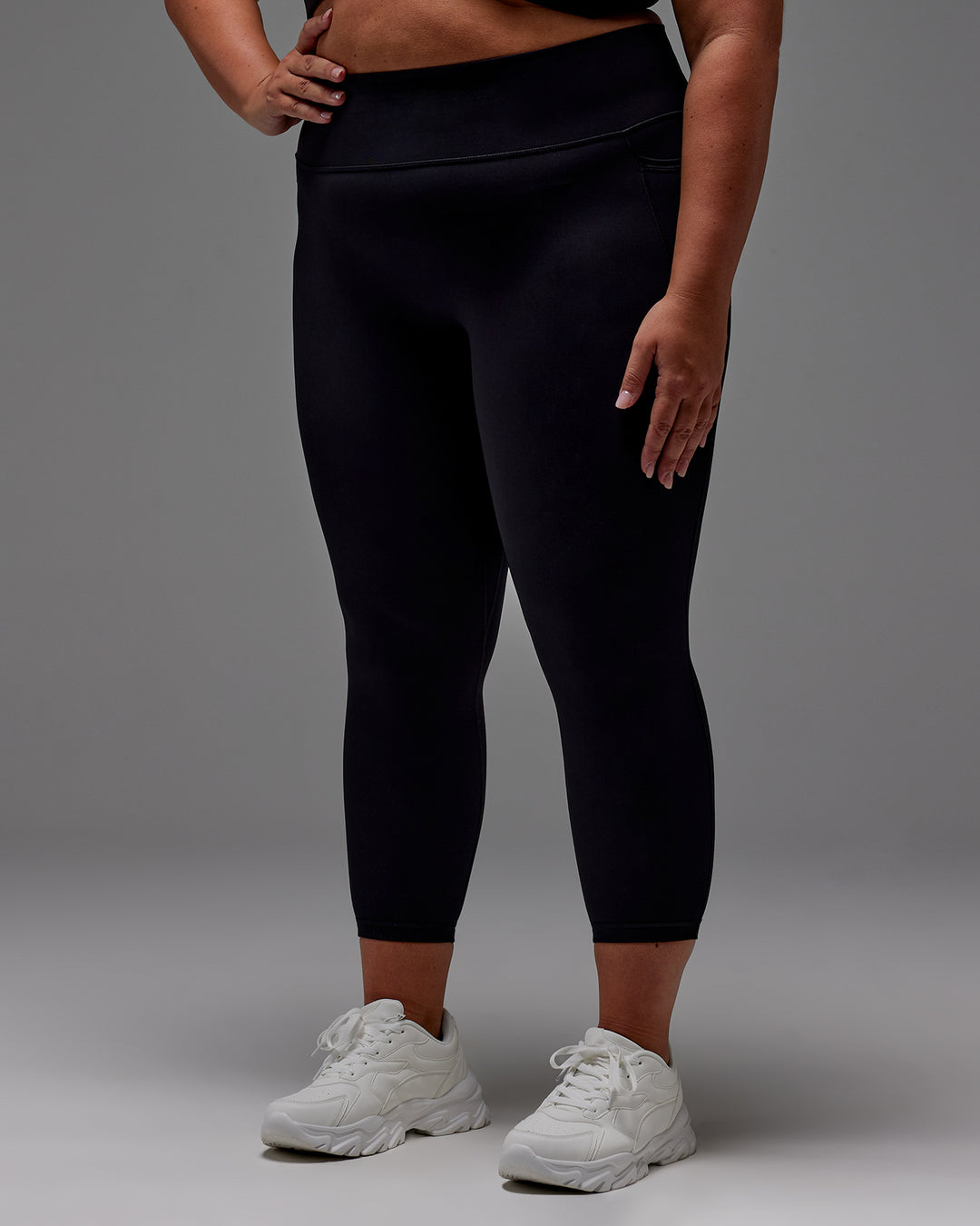 Woman wearing Fusion Ultra High-Rise 7/8 Legging Pockets - Black | Model:Jordie | Size:2XL