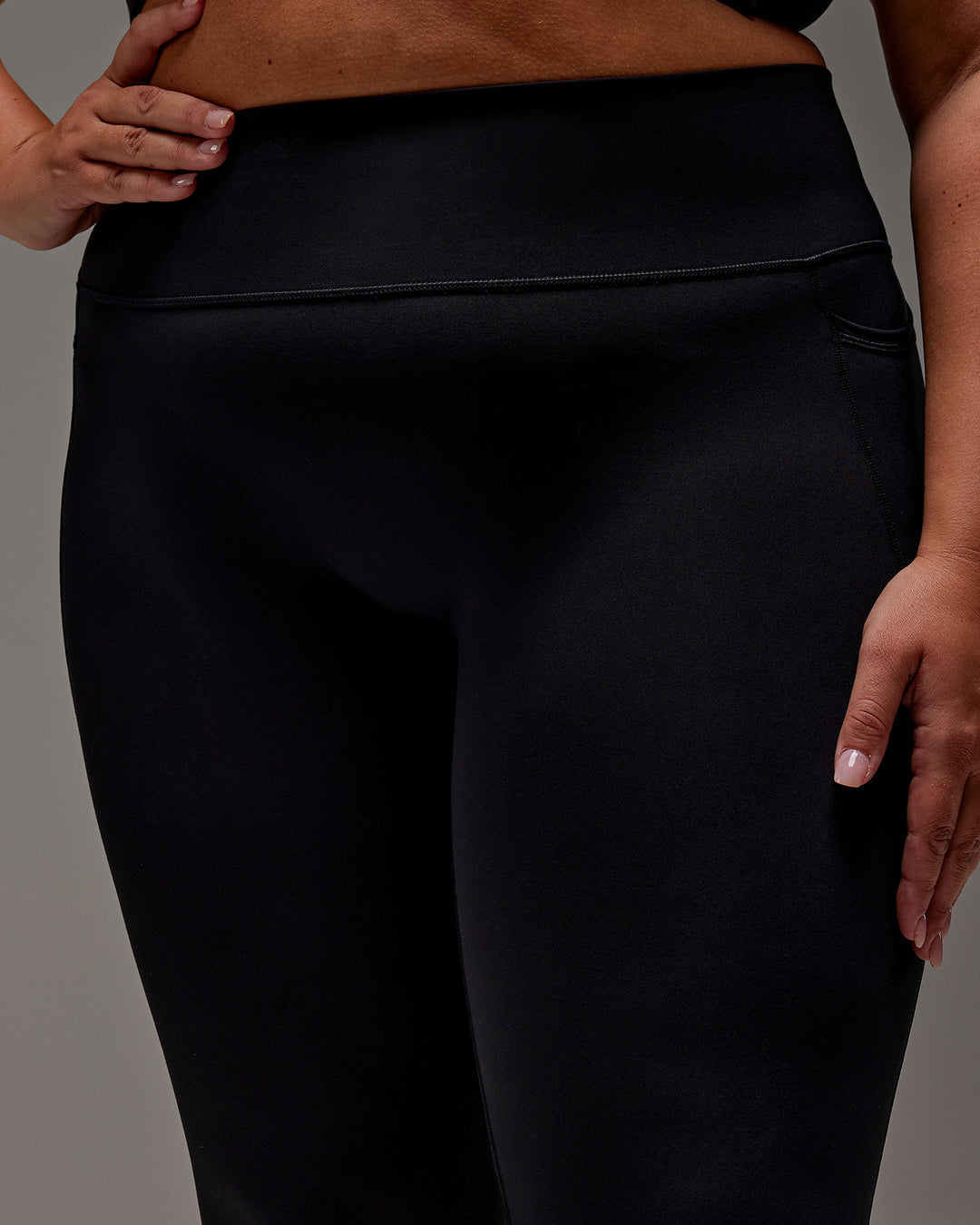 Woman wearing Fusion Ultra High-Rise 7/8 Legging Pockets - Black | Model:Jordie | Size:2XL
