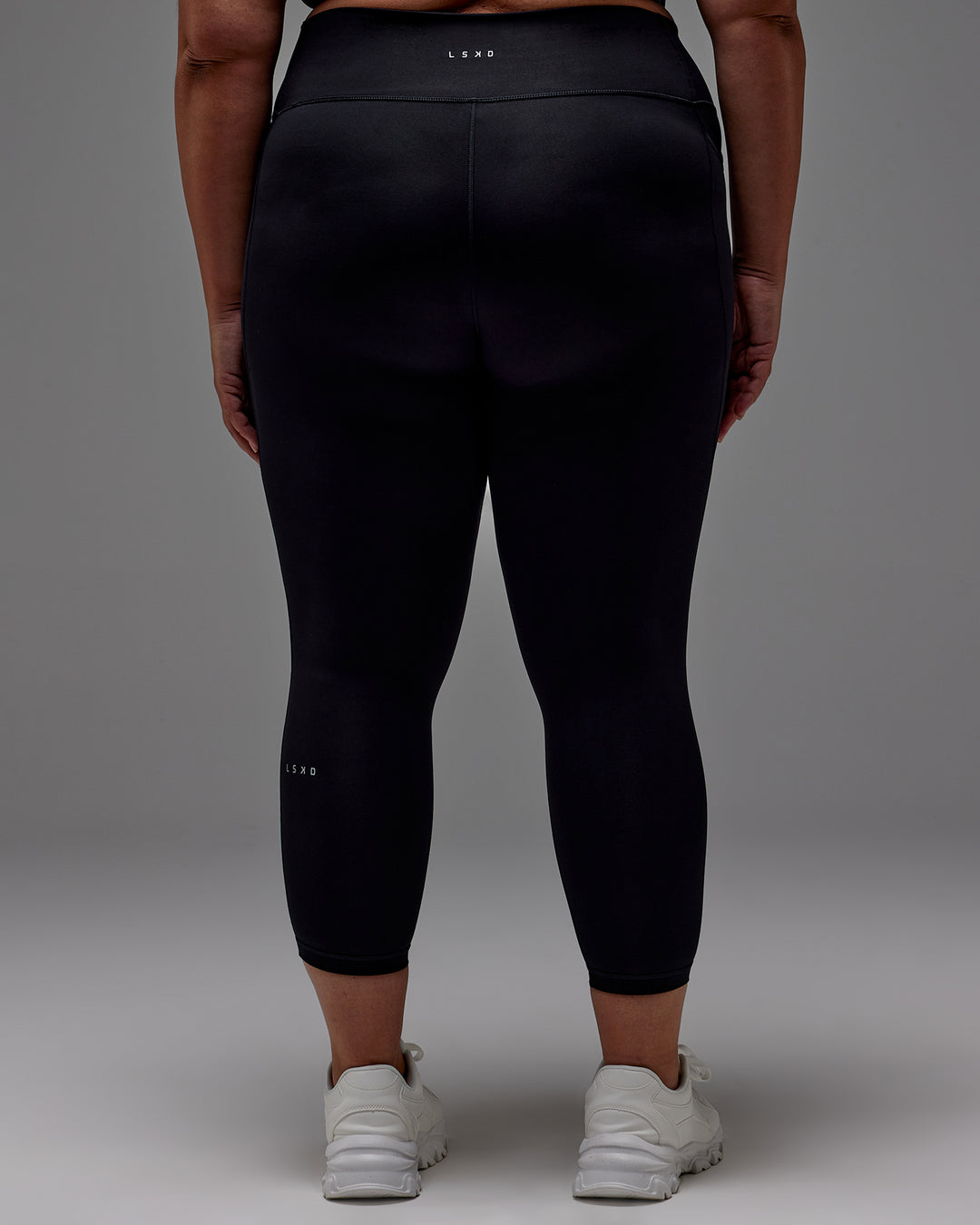 Woman wearing Fusion Ultra High-Rise 7/8 Legging Pockets - Black | Model:Jordie | Size:2XL
