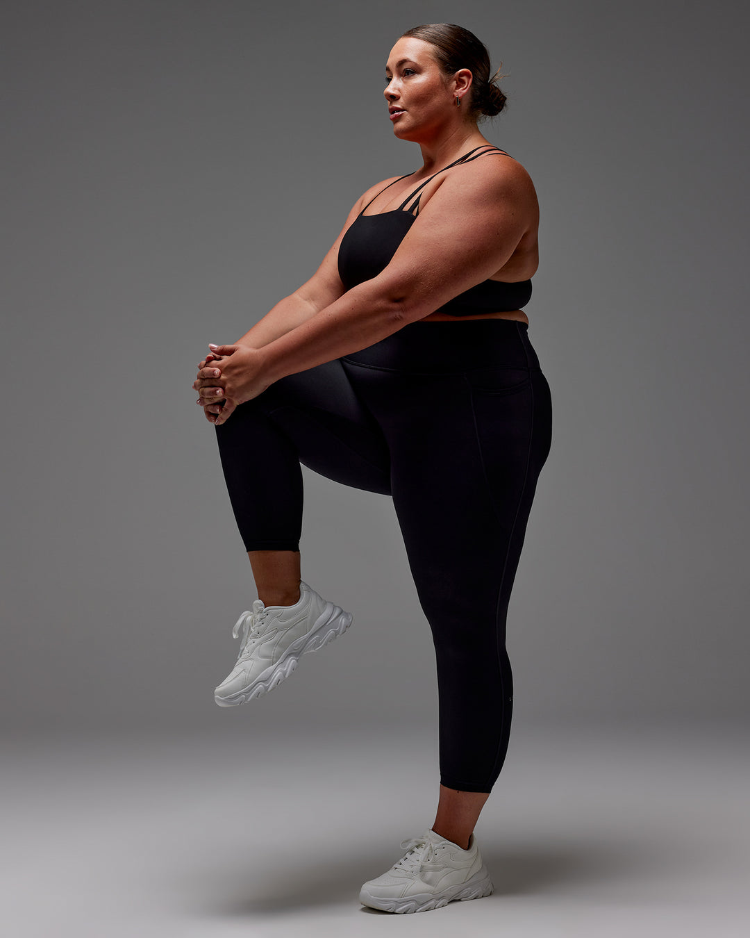 Woman wearing Fusion Ultra High-Rise 7/8 Legging Pockets - Black | Model:Jordie | Size:2XL