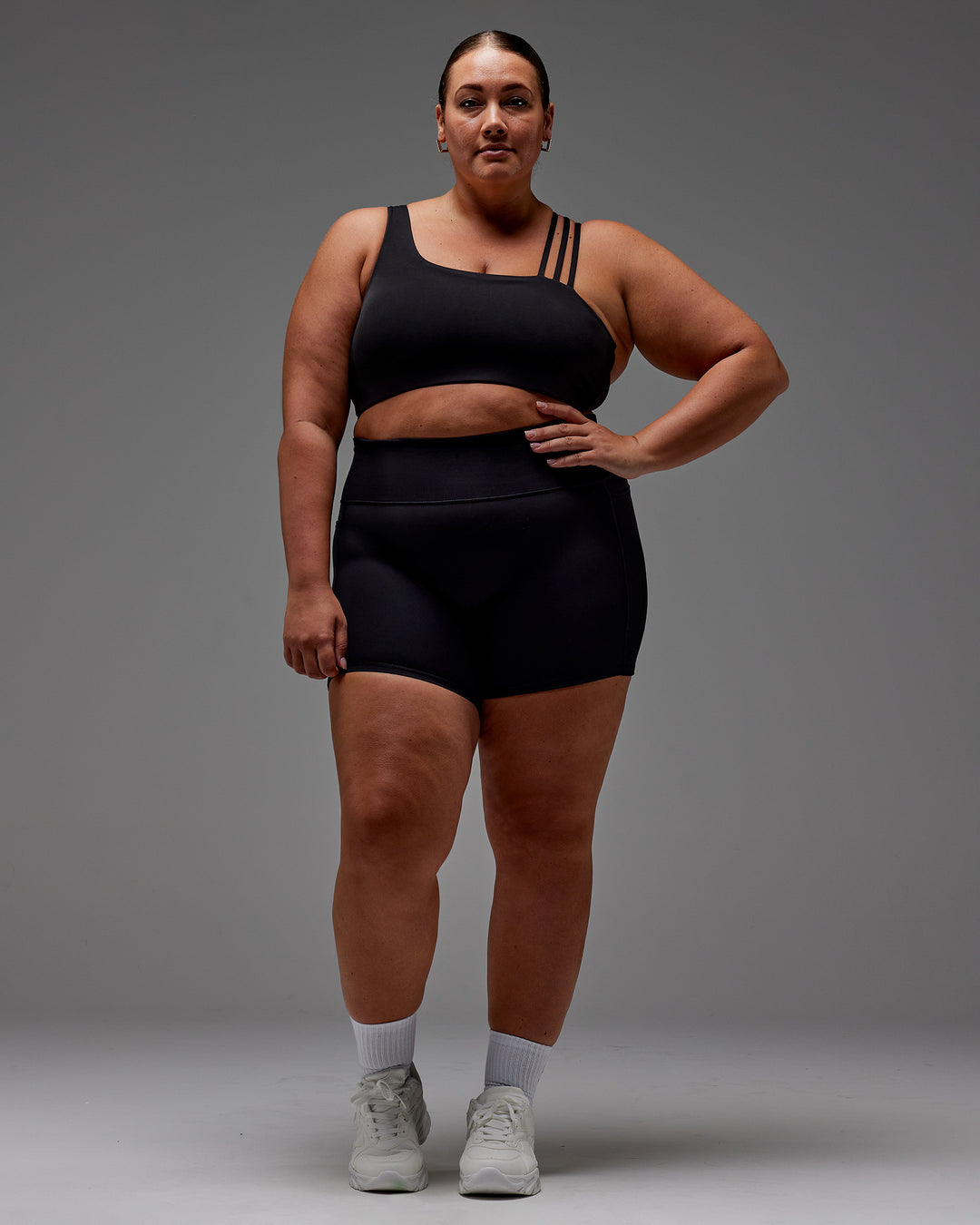 Woman wearing Fusion Ultra High-Rise 6" Short Pockets - Black | Model:Jordie | Size:2XL