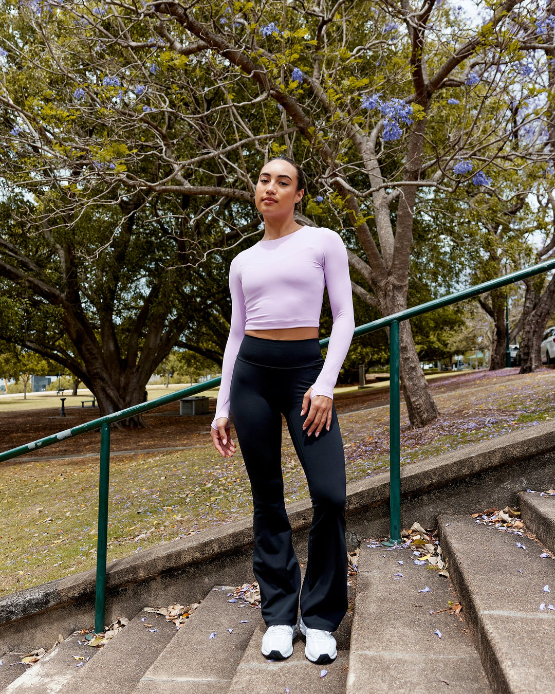 Woman wearing Fusion Ultra High-Rise Flared Legging - Black | Model:Milly | Size:S