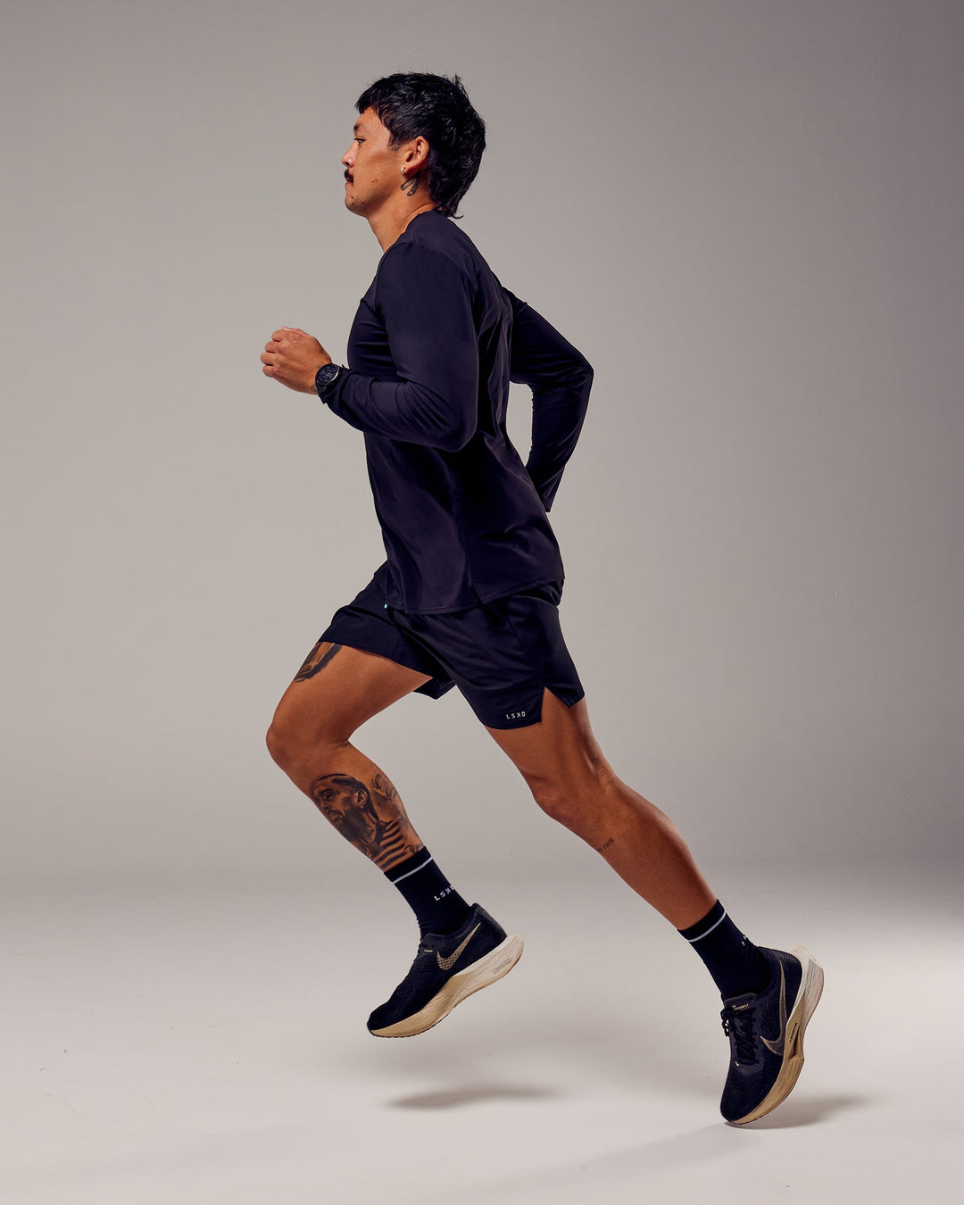 Man wearing Pace 5" Lined Performance Shorts - Black-Retro Blue