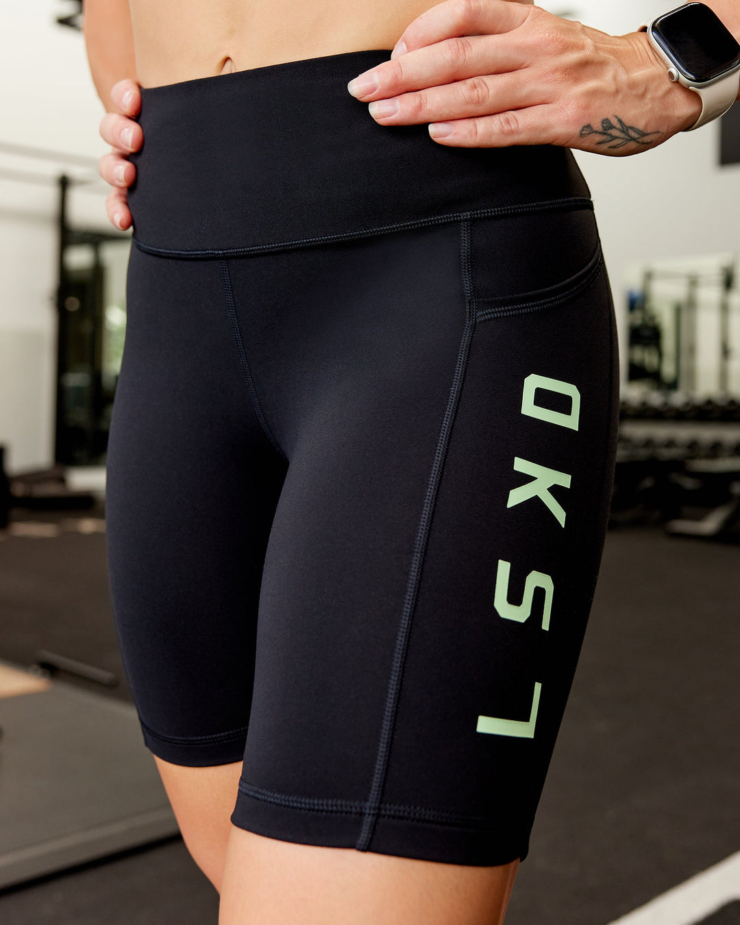 Woman wearing Rep Ultra High-Rise 9" Short Pockets - Black-Surreal Green