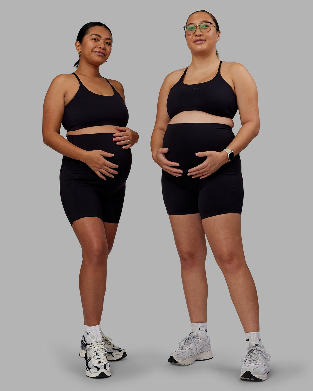 Woman wearing Elixir Ultra High-Rise Maternity 6" Short Pockets - Black | Model:Both | Size:Duo
