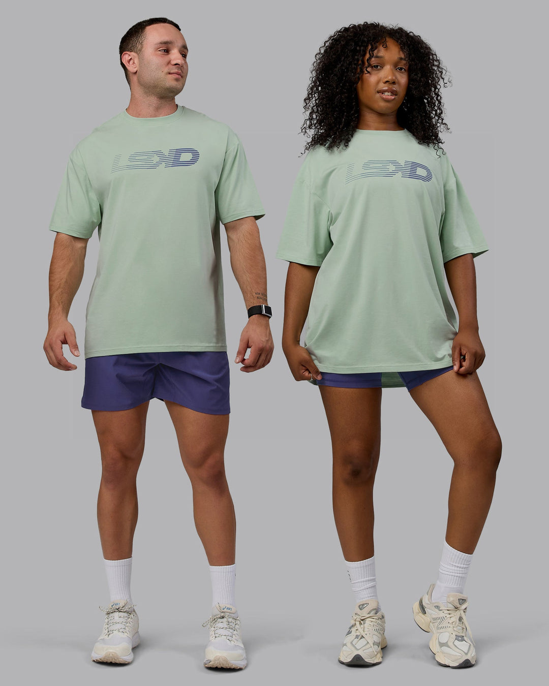 Duo wearing Unisex Motion FLXCotton Tee Oversize - Surf Spray-Royal Purple