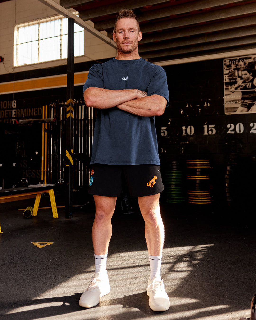 Man wearing Lift 6" Short - Black-Blue Atoll | Model:James | Size:L