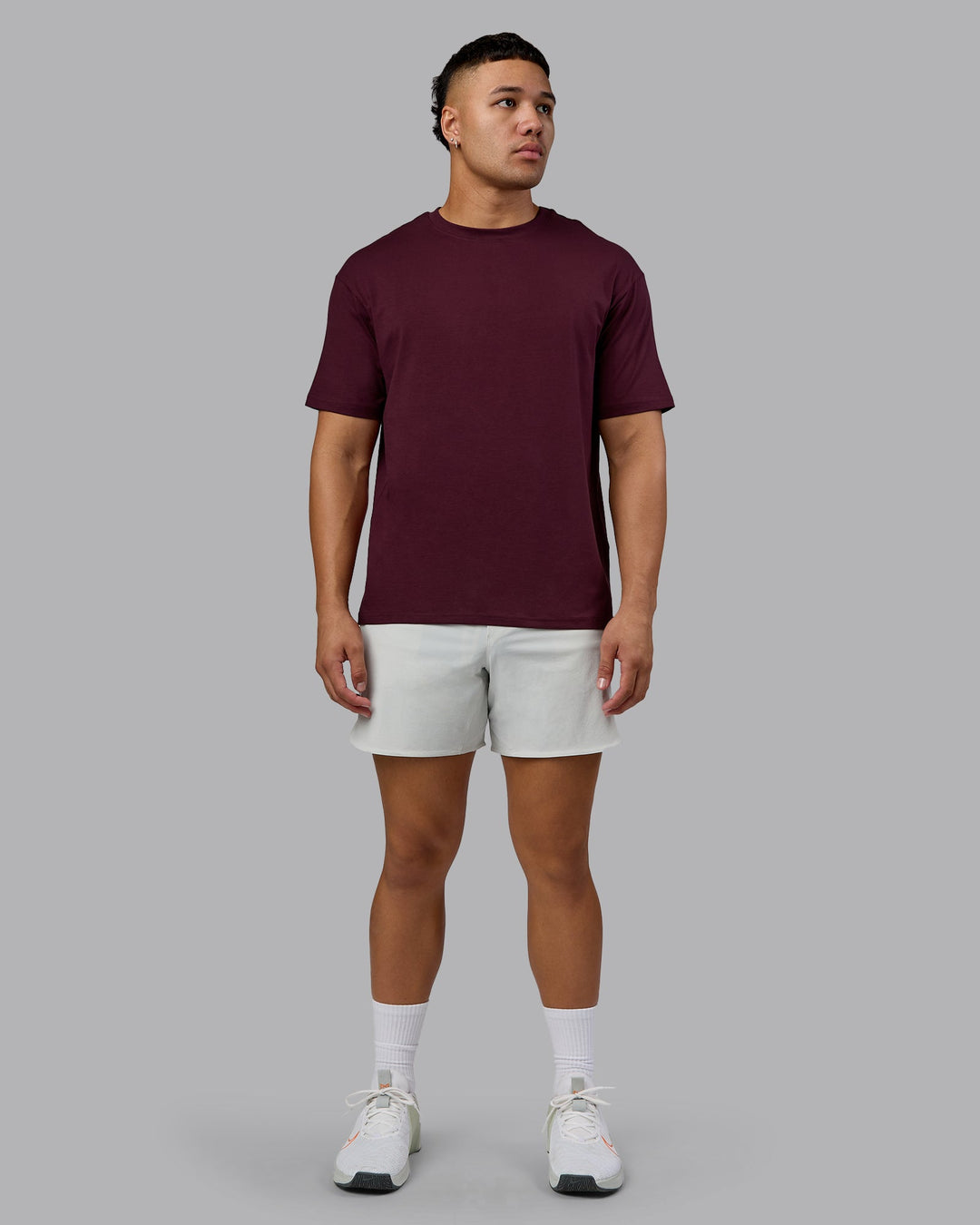 Man wearing Lifting Club FLXCotton Tee Oversize - Cherry Lacquer-White | Model:Kaelyb | Size:L