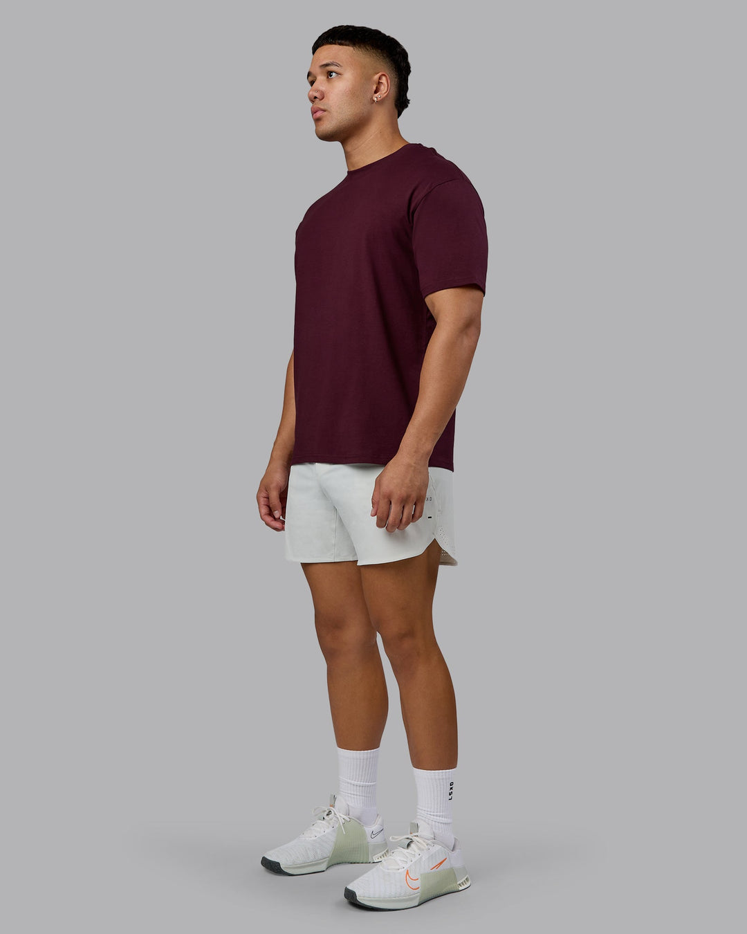 Man wearing Lifting Club FLXCotton Tee Oversize - Cherry Lacquer-White | Model:Kaelyb | Size:L