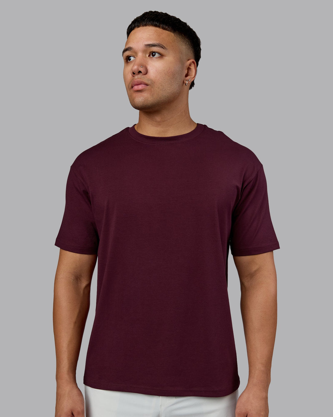 Man wearing Lifting Club FLXCotton Tee Oversize - Cherry Lacquer-White | Model:Kaelyb | Size:L