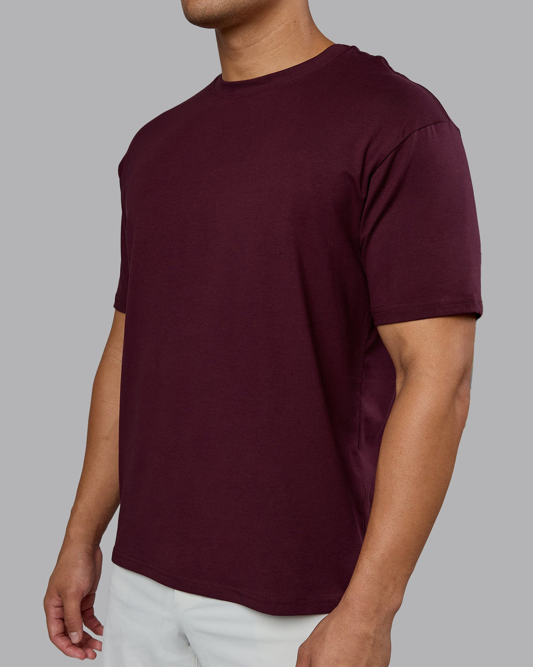 Man wearing Lifting Club FLXCotton Tee Oversize - Cherry Lacquer-White | Model:Kaelyb | Size:L