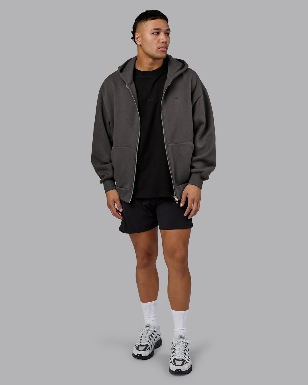 Man wearing MVP Zip Through Oversized Hoodie - Dark Storm | Model:Kaelyb | Size:L