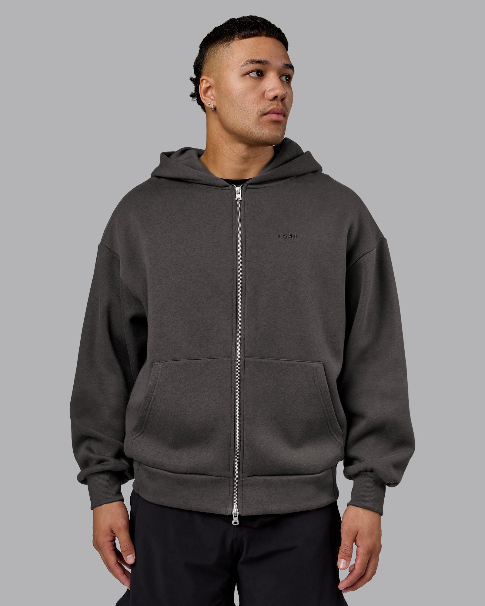 Man wearing MVP Zip Through Oversized Hoodie - Dark Storm | Model:Kaelyb | Size:L