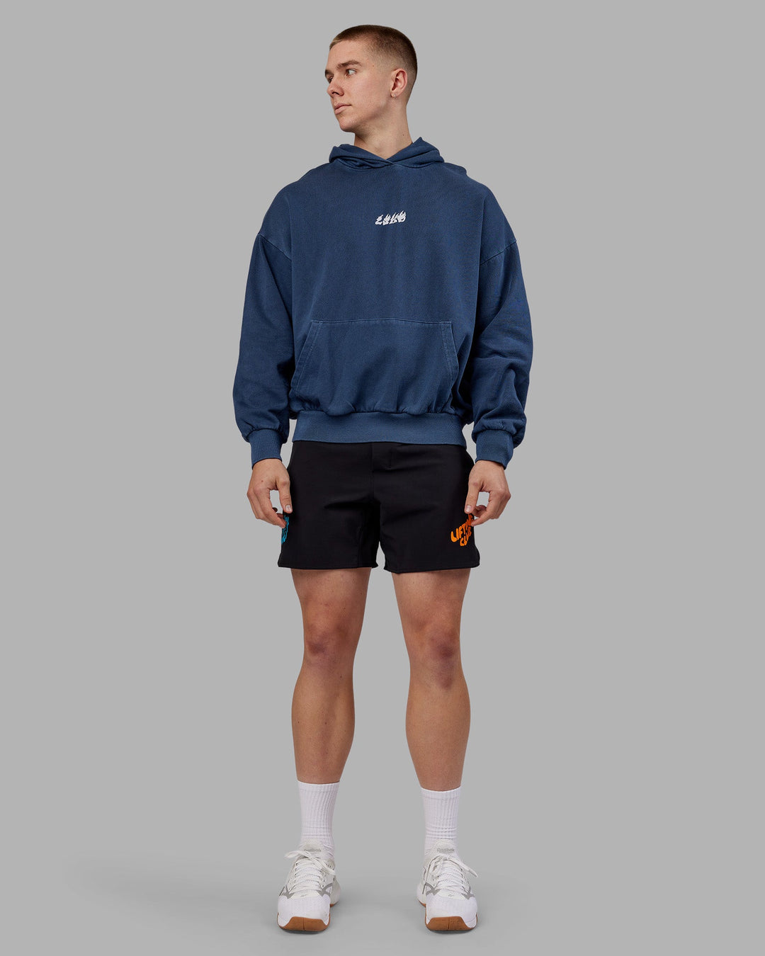 Man wearing NY25 Washed Oversized Hoodie - Future Navy-Ultra Orange | Model:Tom | Size:L