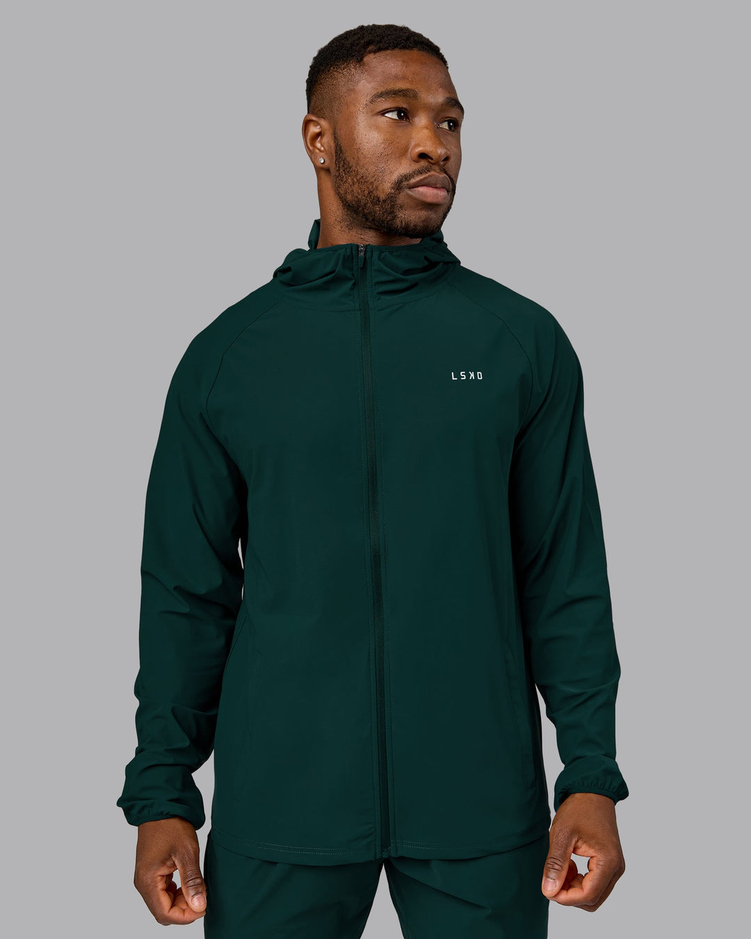 Man wearing Train-Lite FLXMAX Jacket - Dark Moss | Model:Sam | Size:L