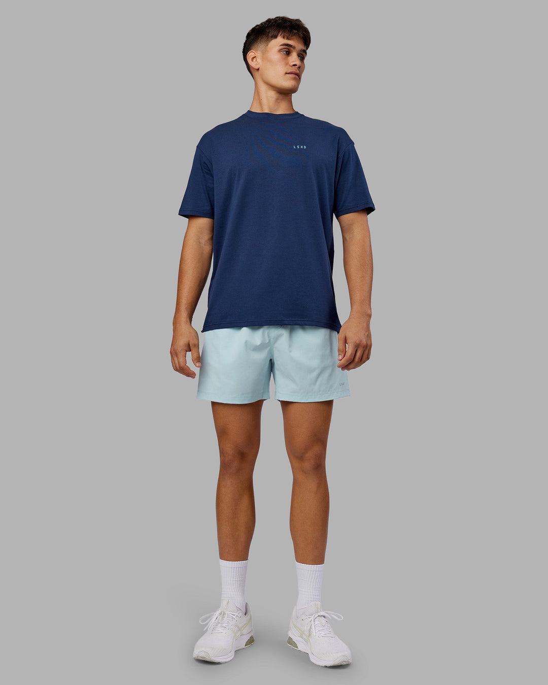 Man wearing Enjoy the Journey Value Series FLXCotton Tee Oversize - Future Navy-Blue Atoll | Model:Jackson | Size:L