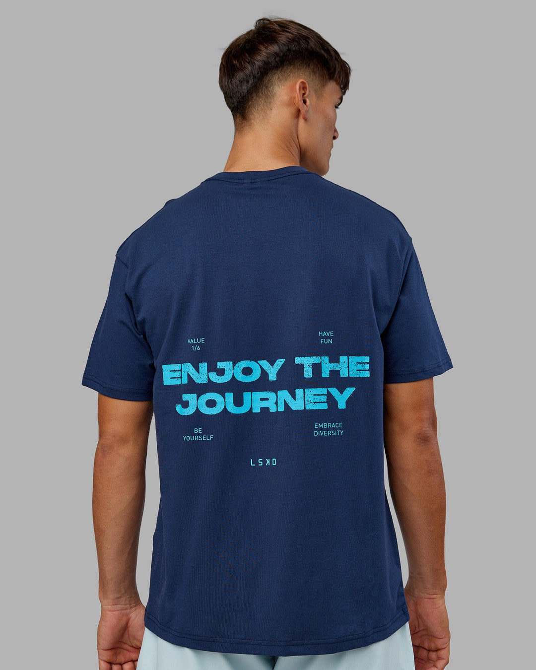 Man wearing Enjoy the Journey Value Series FLXCotton Tee Oversize - Future Navy-Blue Atoll | Model:Jackson | Size:L