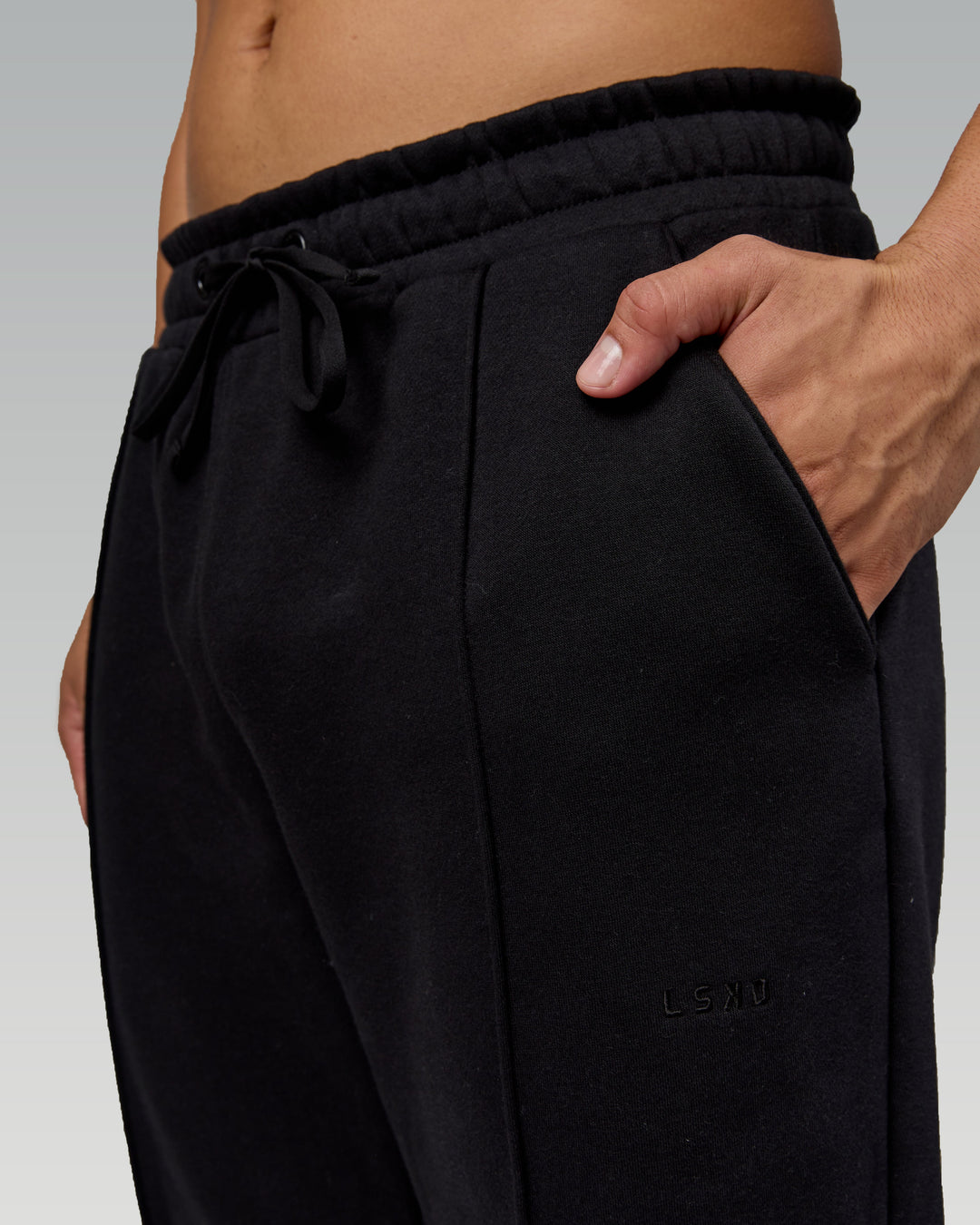 Man wearing Urban Cropped Track Pant - Black| Model:Kaelyb | Size:L