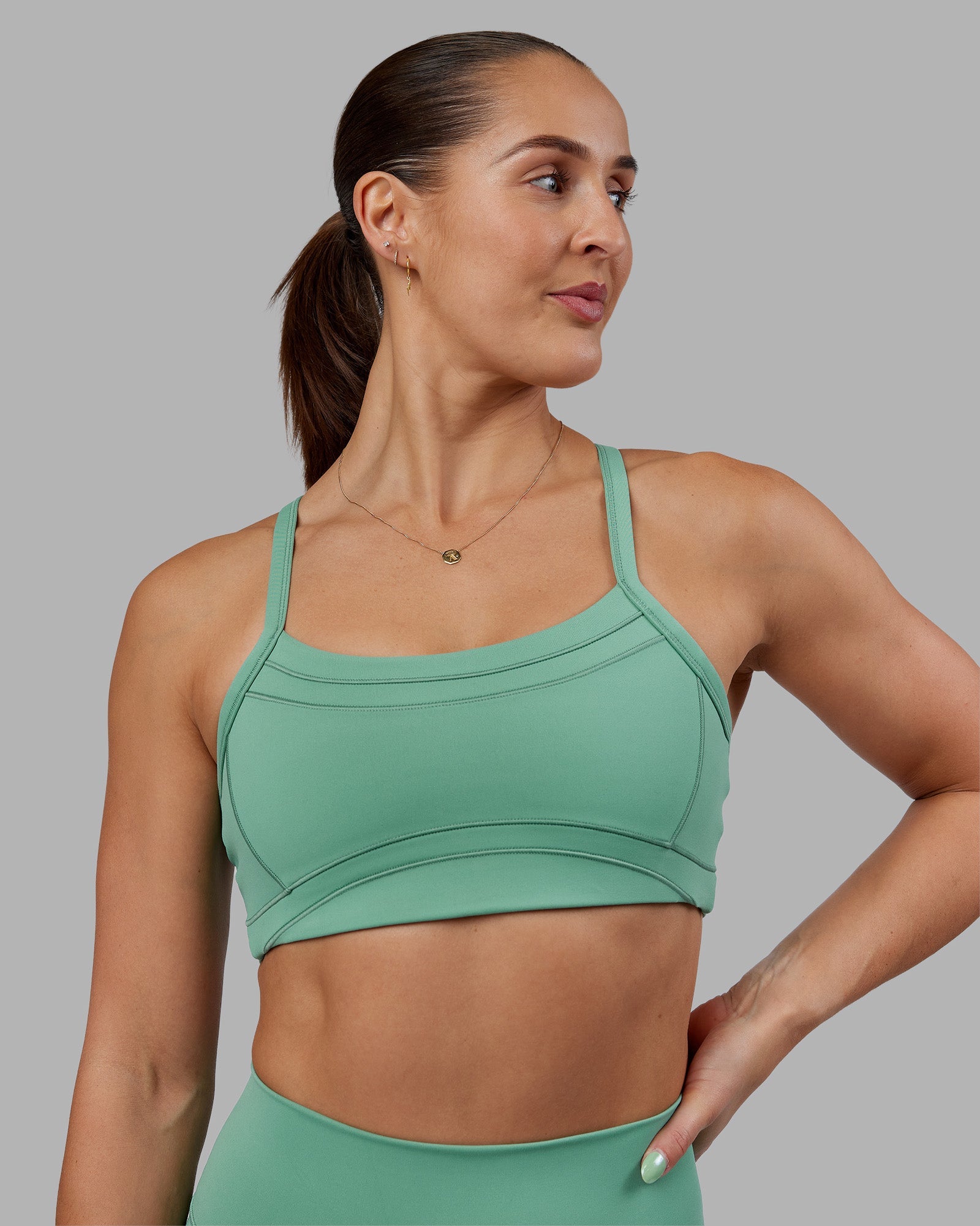 Woman wearing Abs Ignite Sports Bra - Matcha Green | Model:Abbey | Size:M