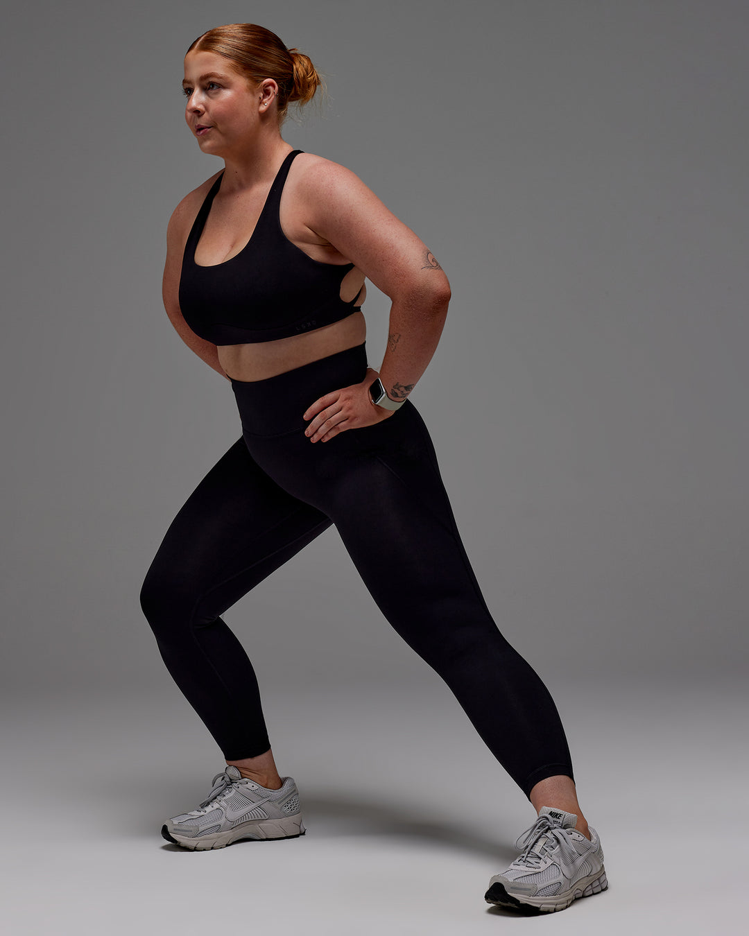 Woman wearing Fusion Ultra High-Rise 7/8 Legging Pockets - Black | Model:Caity | Size:M