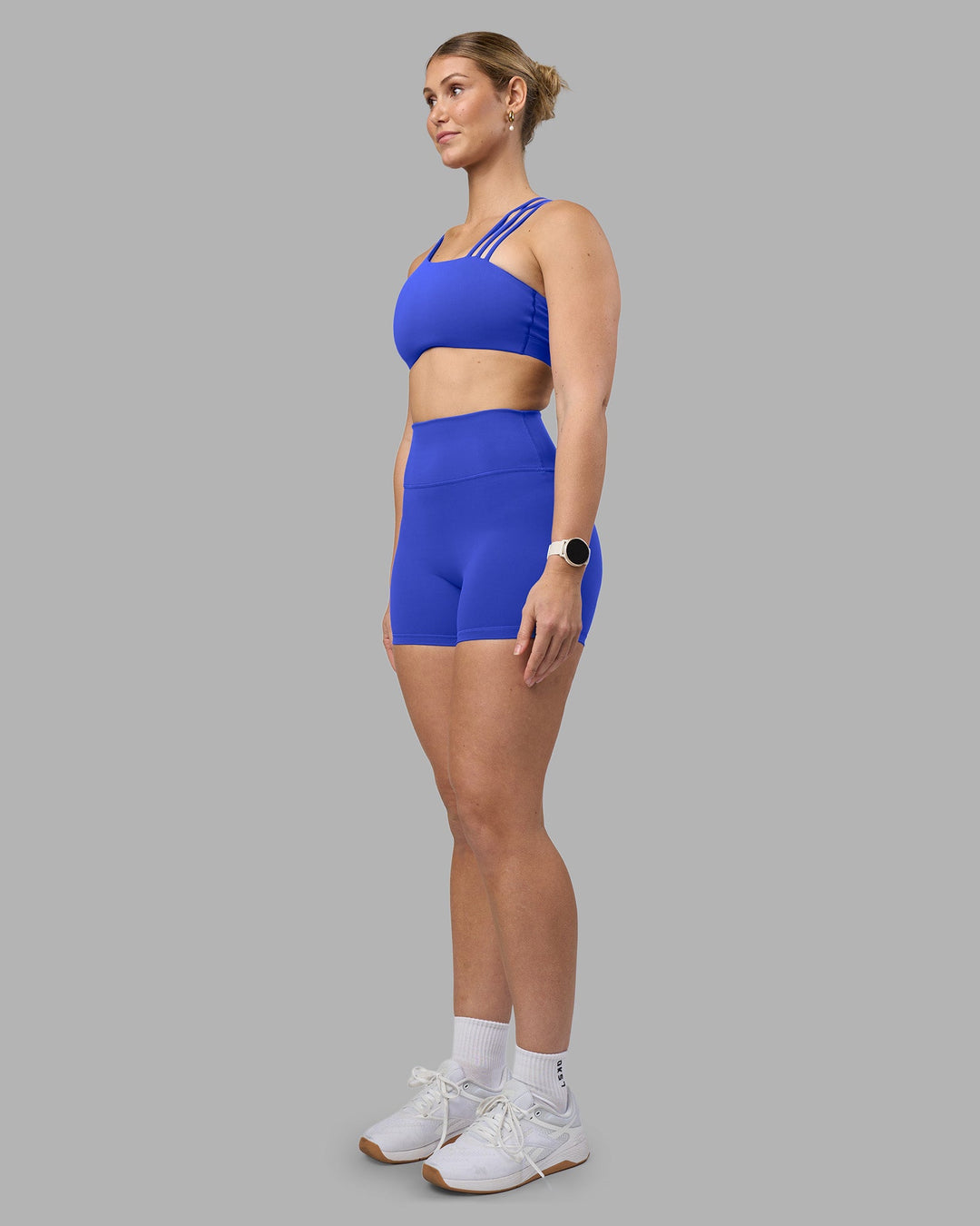 Woman wearing Fusion Ultra High-Rise 4" Short - Power Cobalt | Model:Amy | Size:M