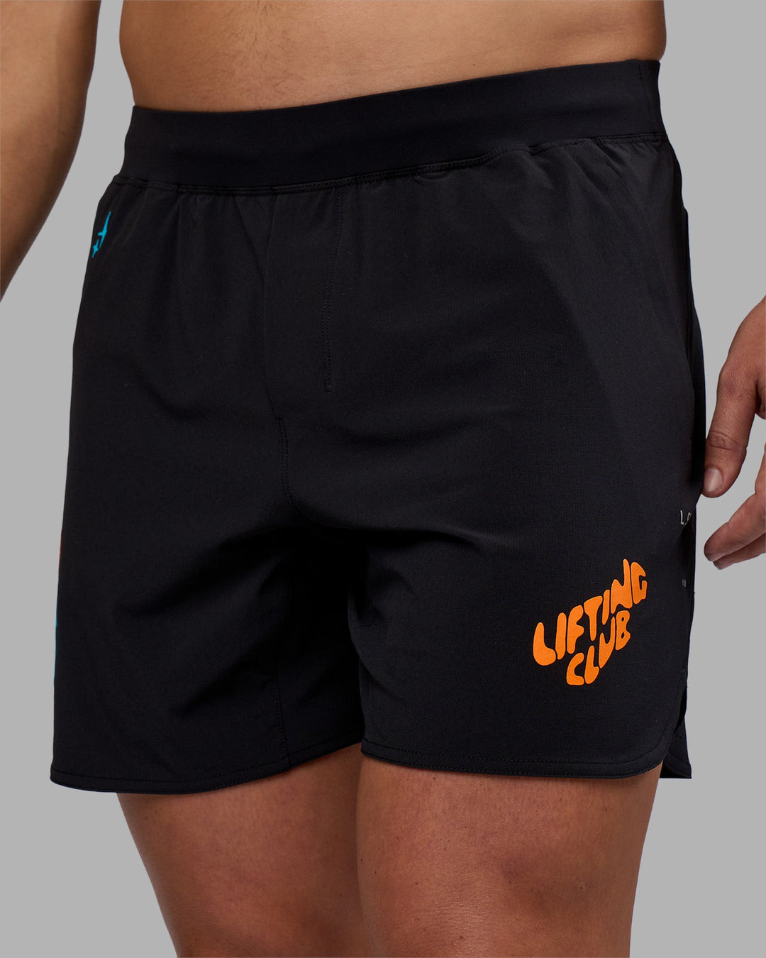 Man wearing Lift 6" Short - Black-Blue Atoll | Model:Jaiden | Size:M