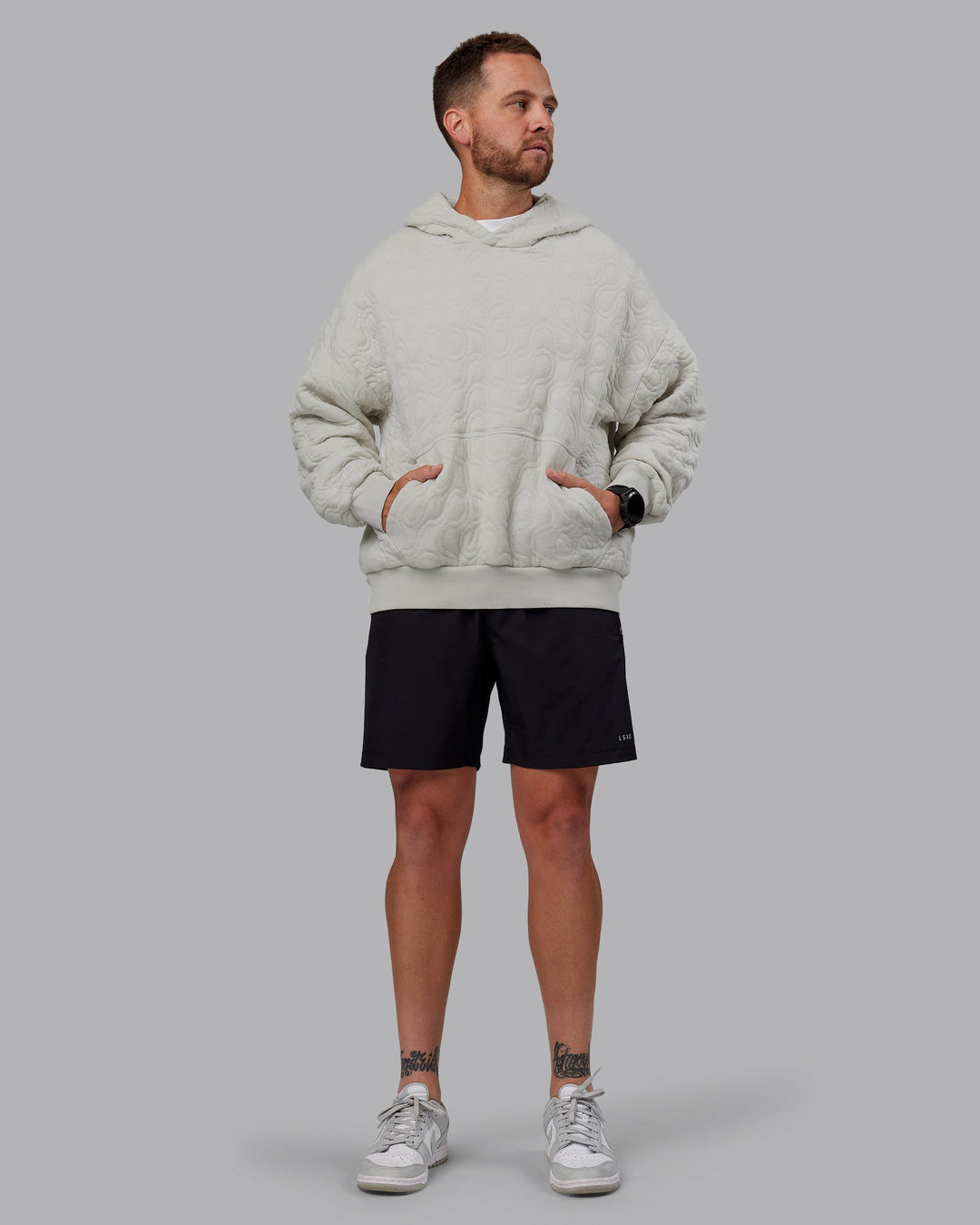 Man wearing MVP Quilted Oversized Hoodie - Digital Mist-Geometric | Model:Macca | Size:M