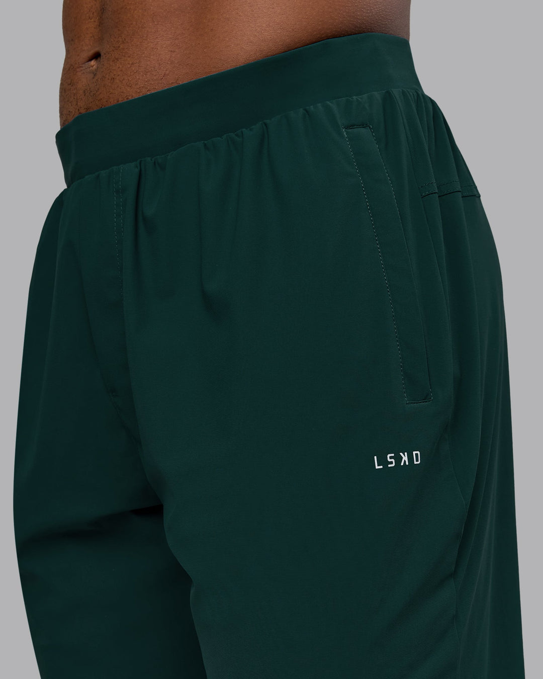 Man wearing Train-Lite FLXMAX Pant - Dark Moss | Model:Sam | Size:L
