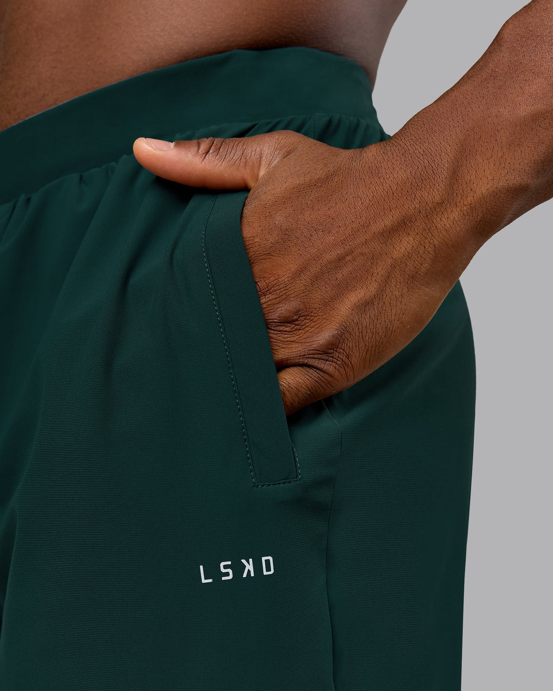 Man wearing Train-Lite FLXMAX Pant - Dark Moss | Model:Sam | Size:L