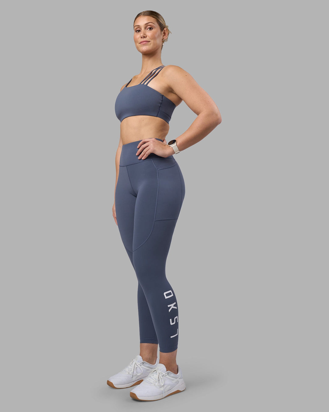 Woman wearing Rep Ultra High-Rise 7/8 Legging Pockets - Night Shadow-White | Model:Amy | Size:M