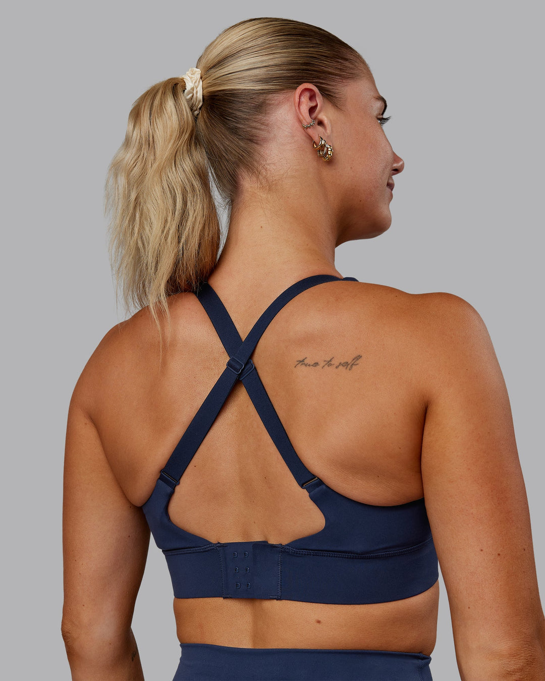 Woman wearing Accelerate Sports Bra in Future Navy | Model:Hannah | Size:S