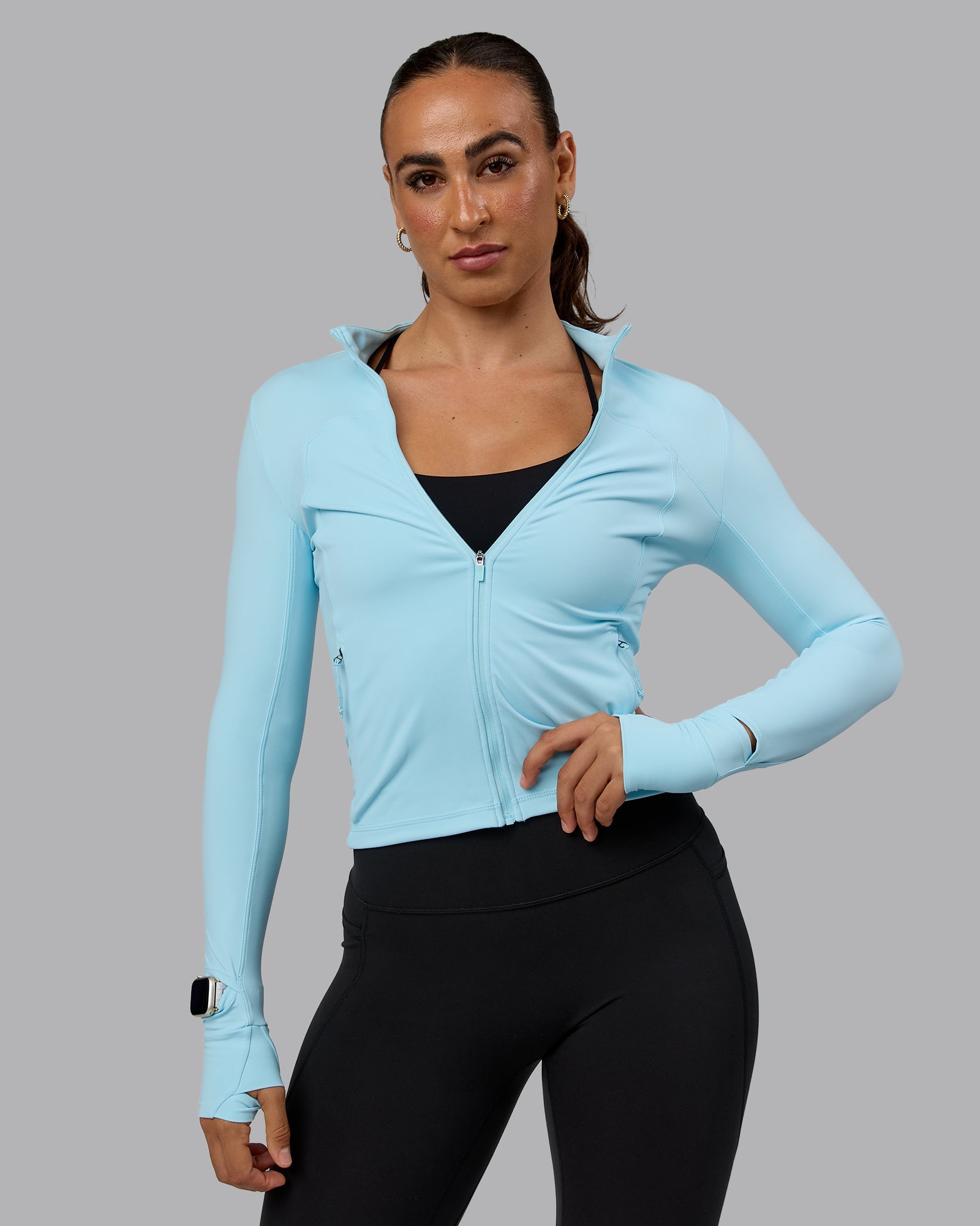 Woman wearing Aspire Jacket - Crystal Blue
