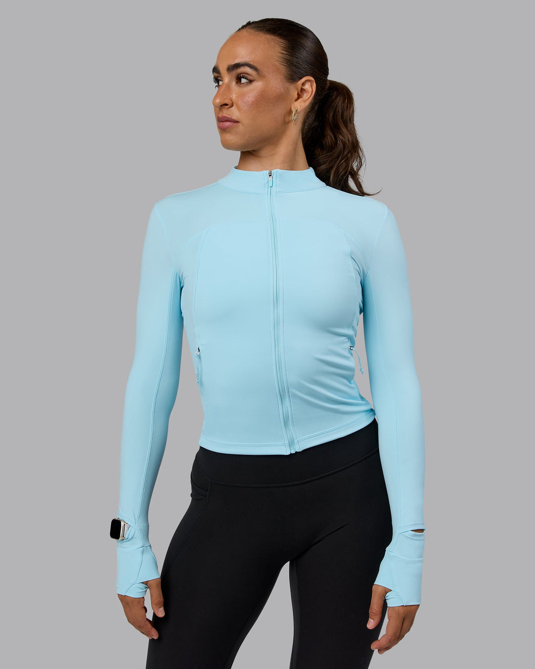 Woman wearing Aspire Jacket - Crystal Blue