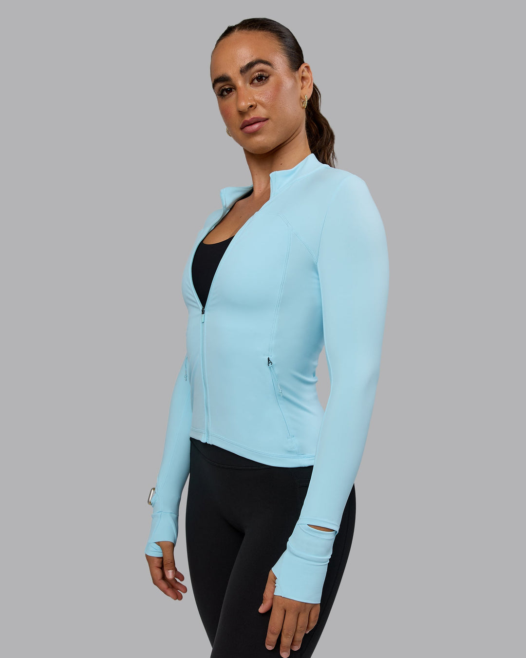 Woman wearing Aspire Jacket - Crystal Blue