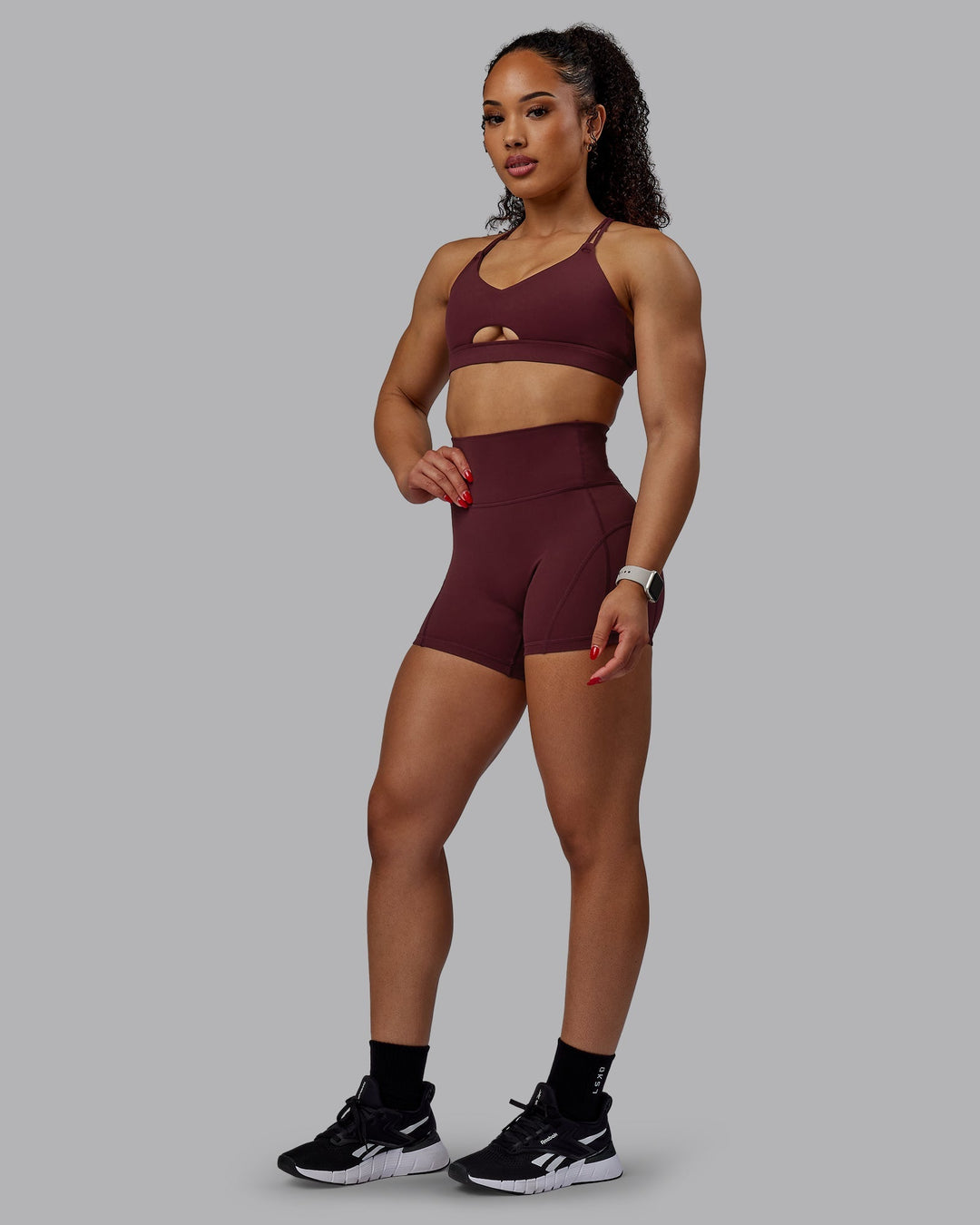 Woman wearing Bend Ultra High-Rise 4" Short - Dark Cherry