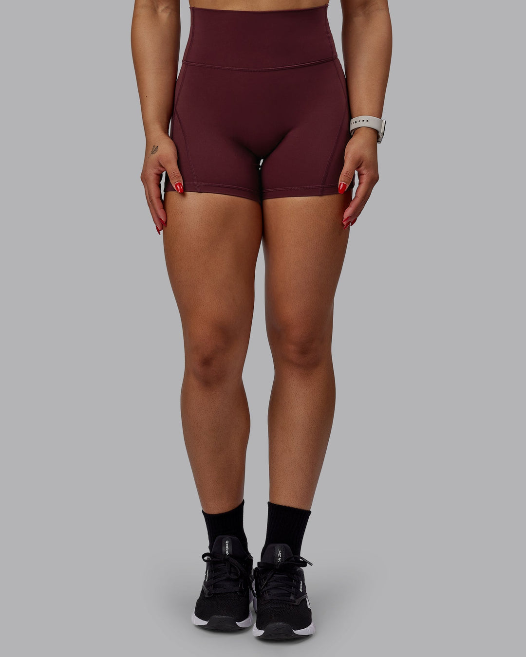 Woman wearing Bend Ultra High-Rise 4" Short - Dark Cherry