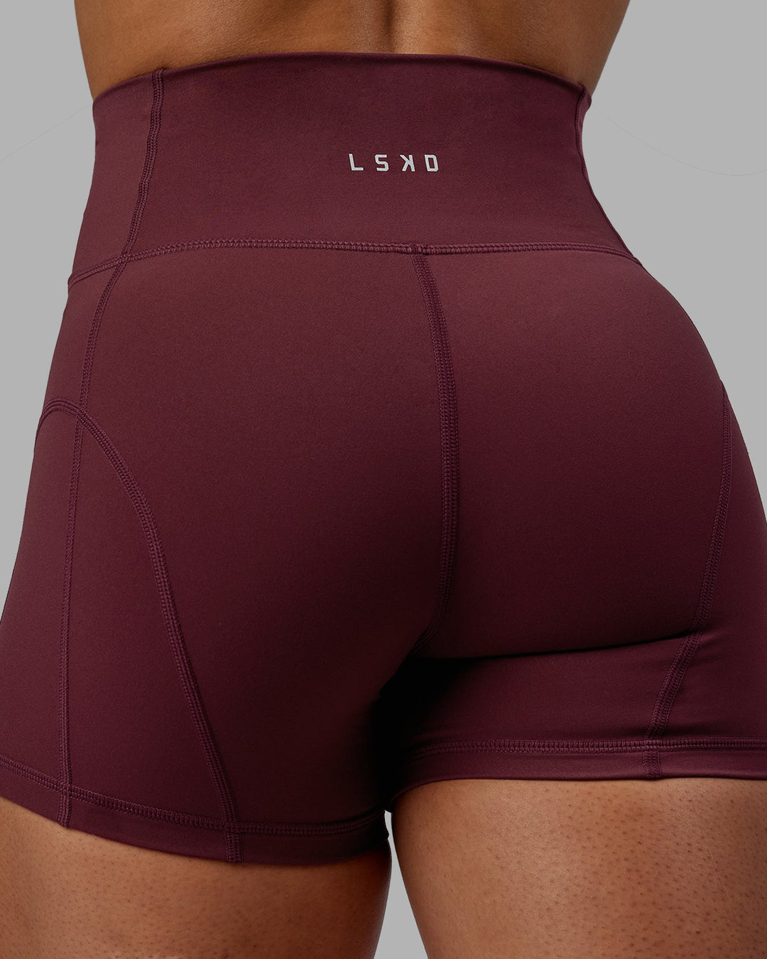 Woman wearing Bend Ultra High-Rise 4" Short - Dark Cherry