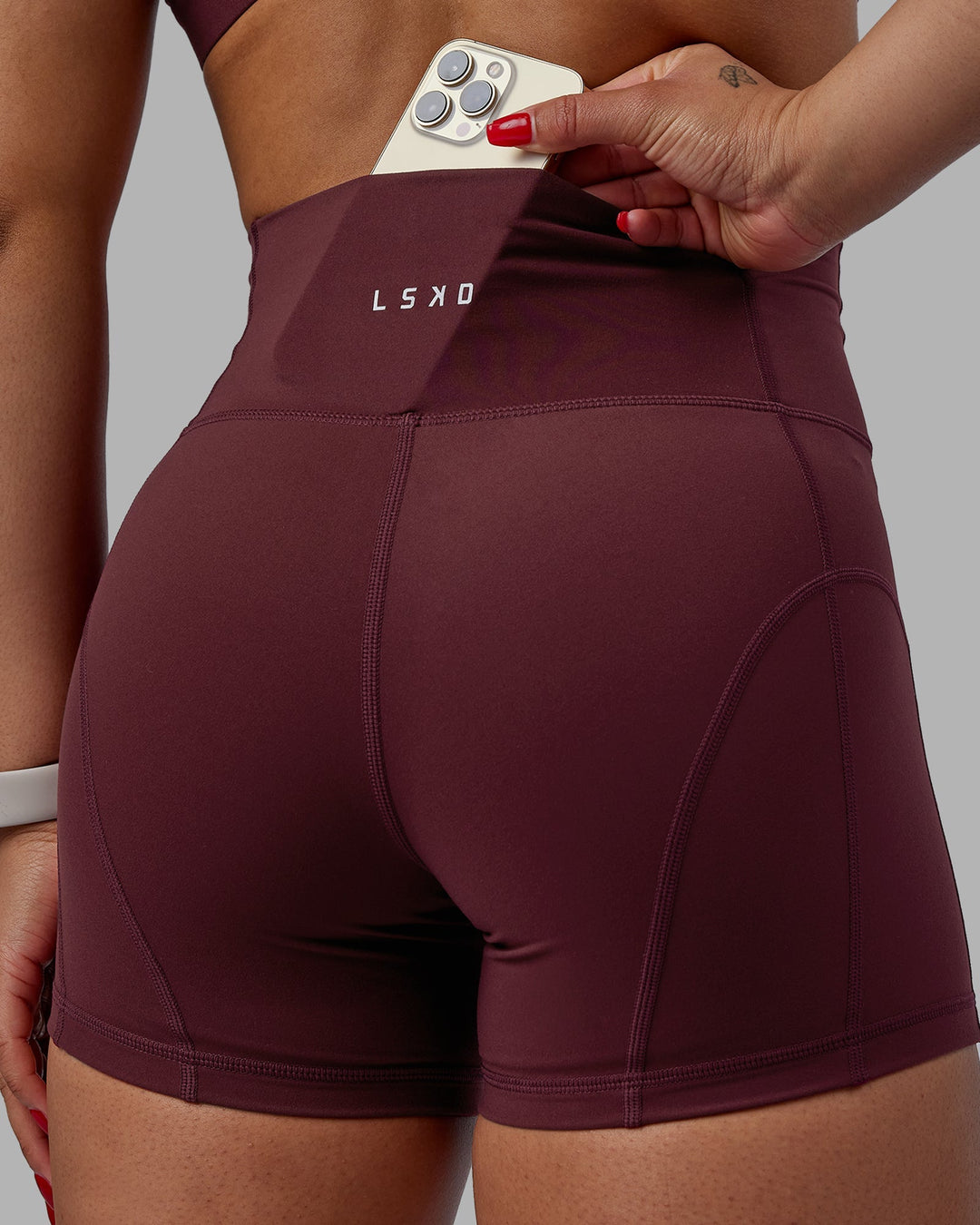 Woman wearing Bend Ultra High-Rise 4" Short - Dark Cherry
