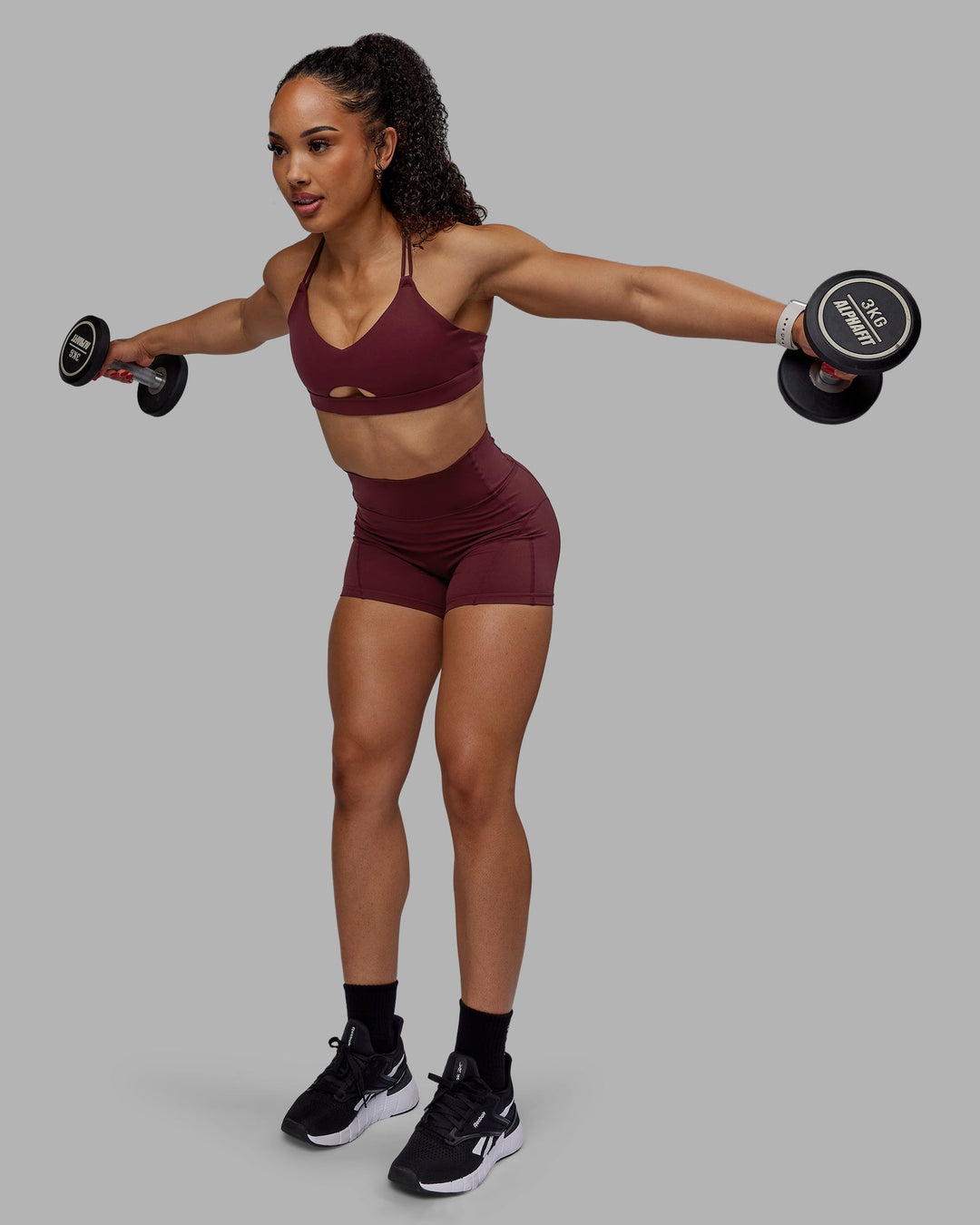 Woman wearing Bend Ultra High-Rise 4" Short - Dark Cherry