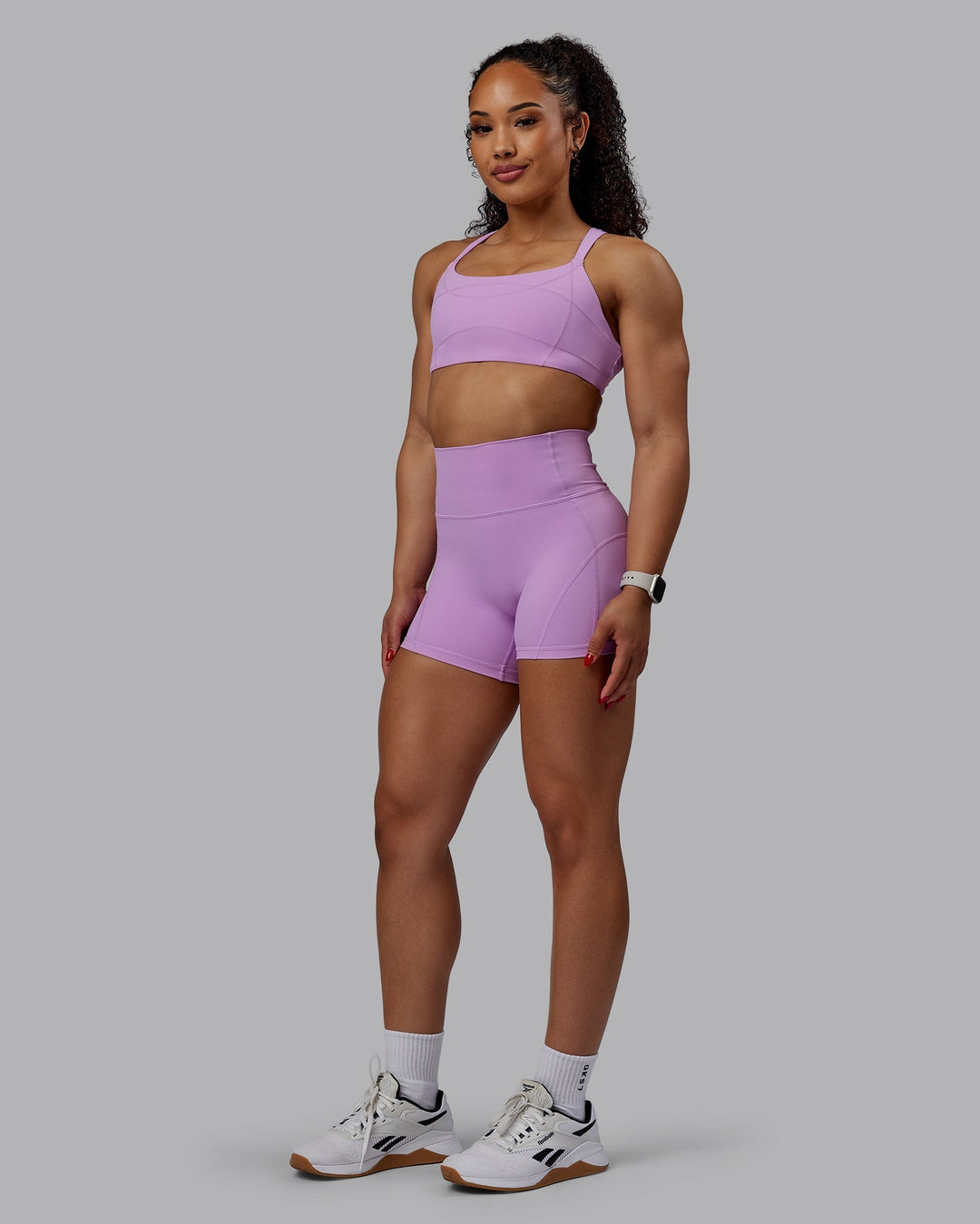 Woman wearing Bend Ultra High-Rise 4" Short - Light Violet