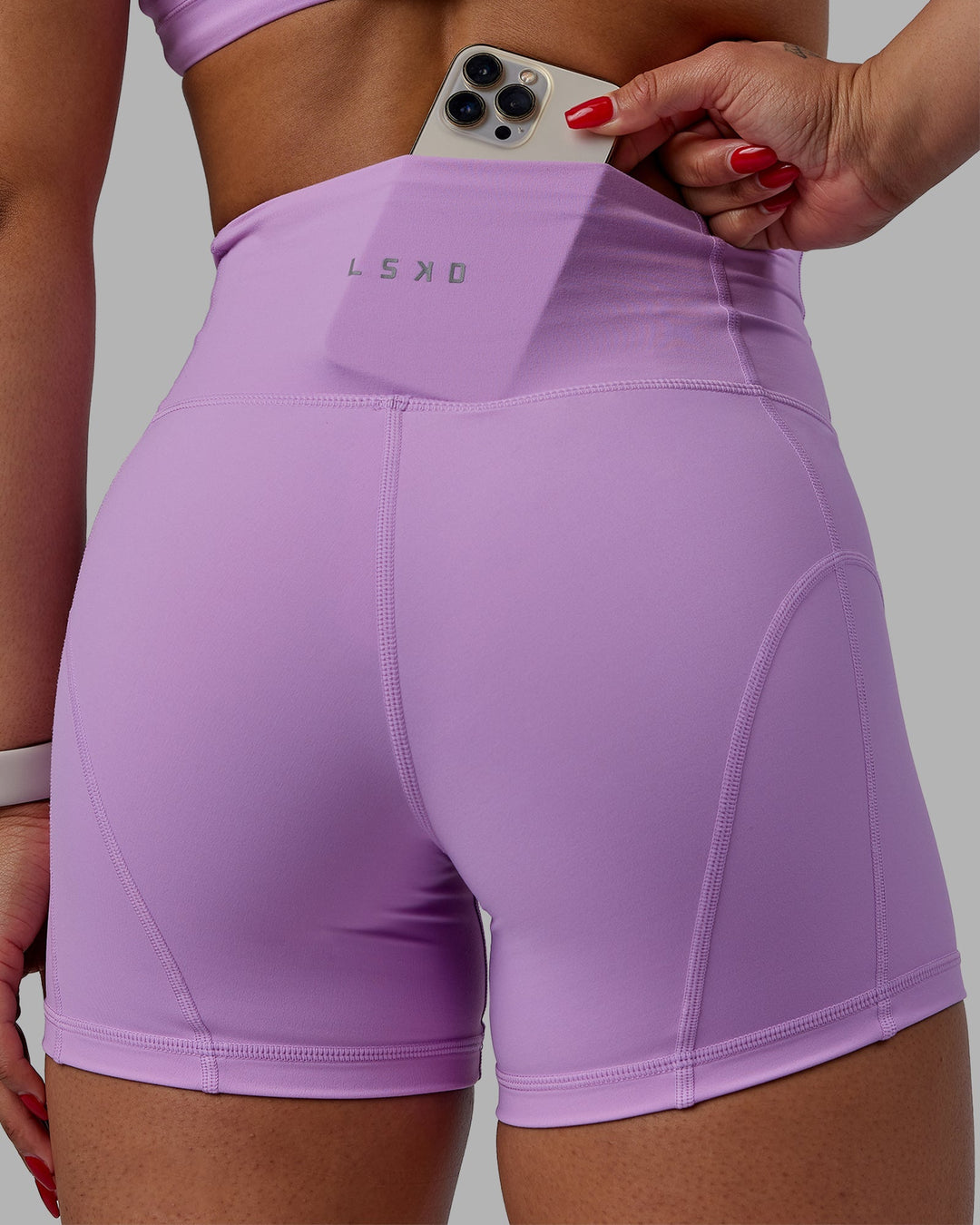 Woman wearing Bend Ultra High-Rise 4" Short - Light Violet
