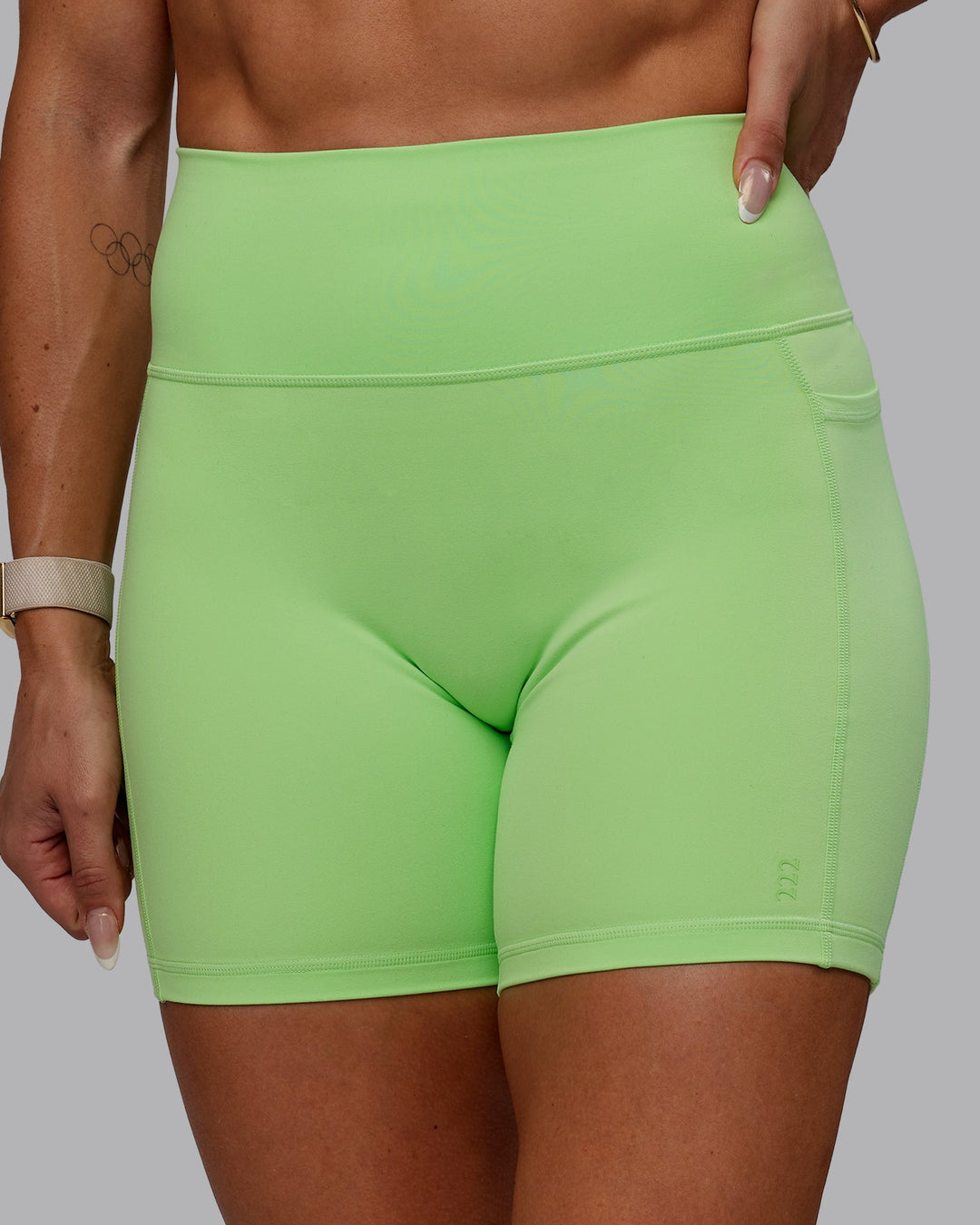 Woman wearing Bree Masters Fusion Ultra High-Rise 6" Short Pockets - Pastel Lime