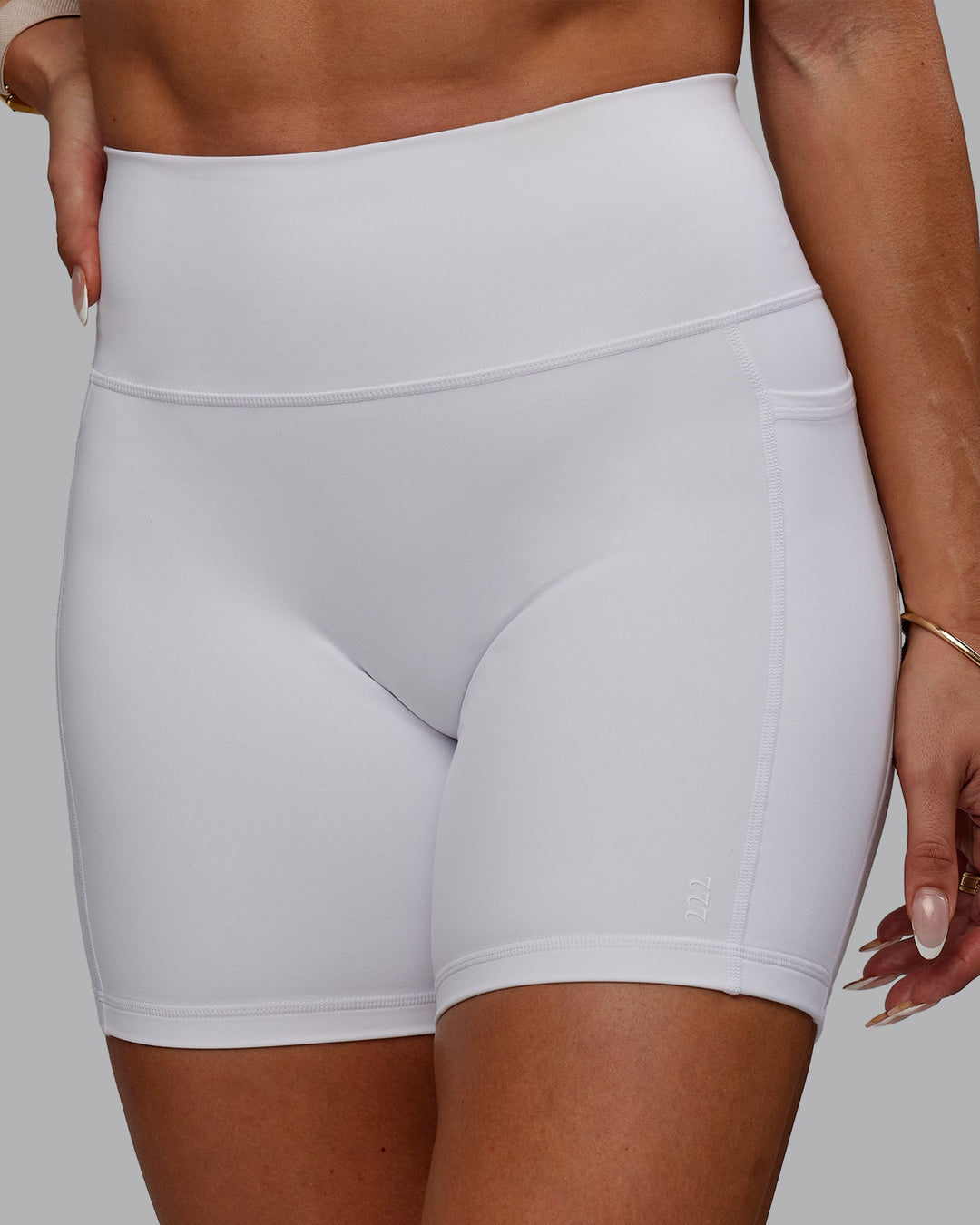Woman wearing Bree Masters Fusion Ultra High-Rise 6" Short Pockets - White