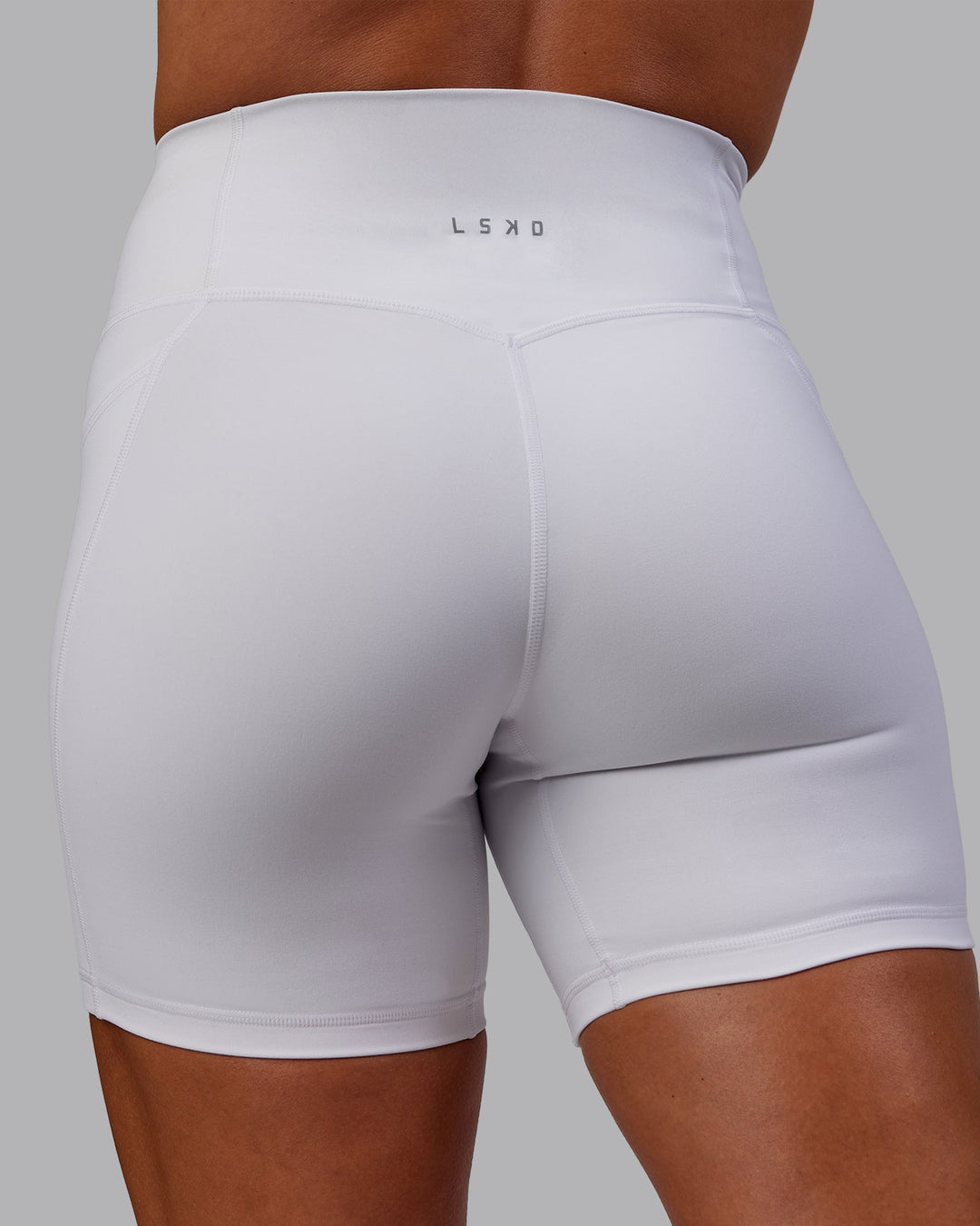 Woman wearing Bree Masters Fusion Ultra High-Rise 6" Short Pockets - White