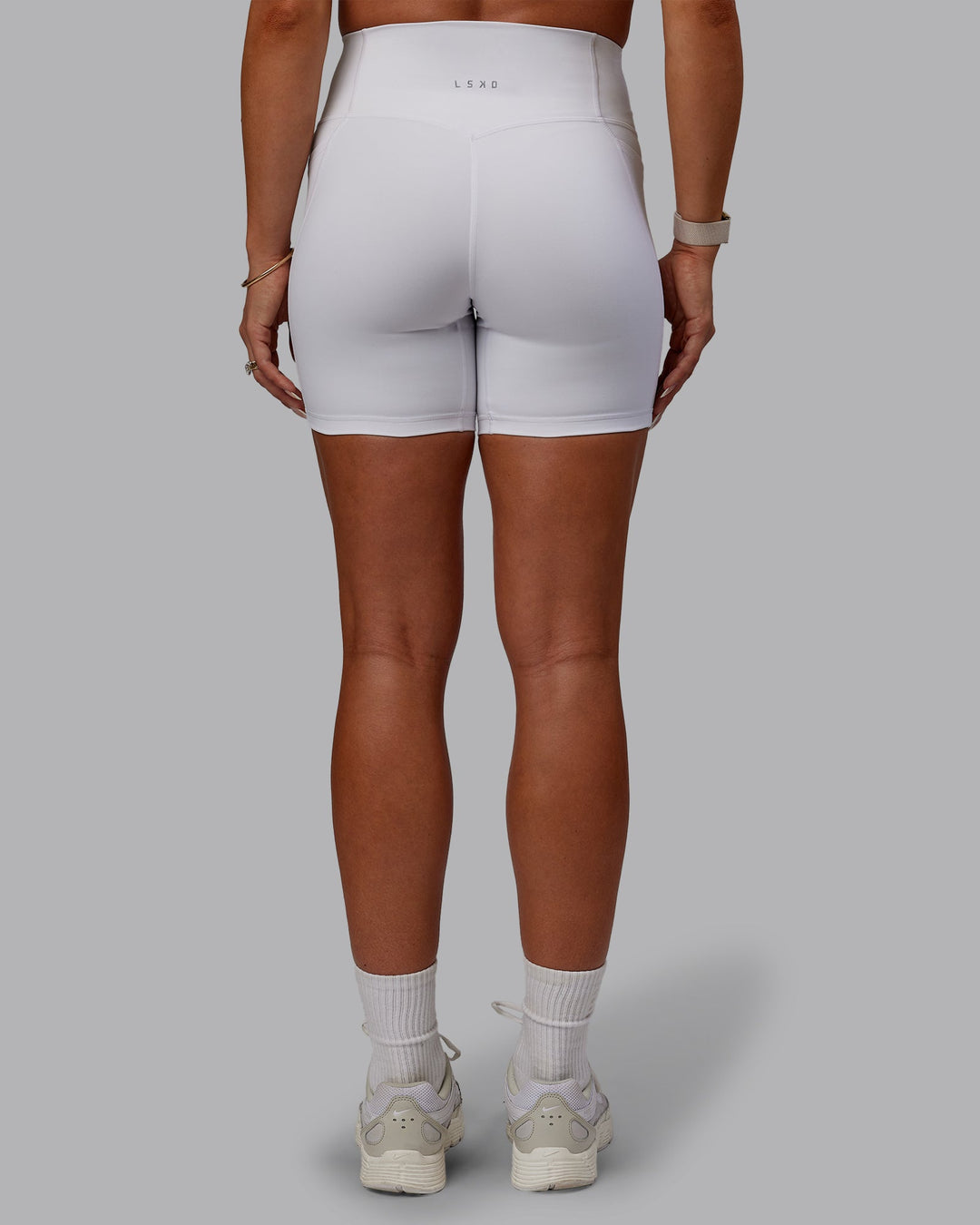 Woman wearing Bree Masters Fusion Ultra High-Rise 6" Short Pockets - White
