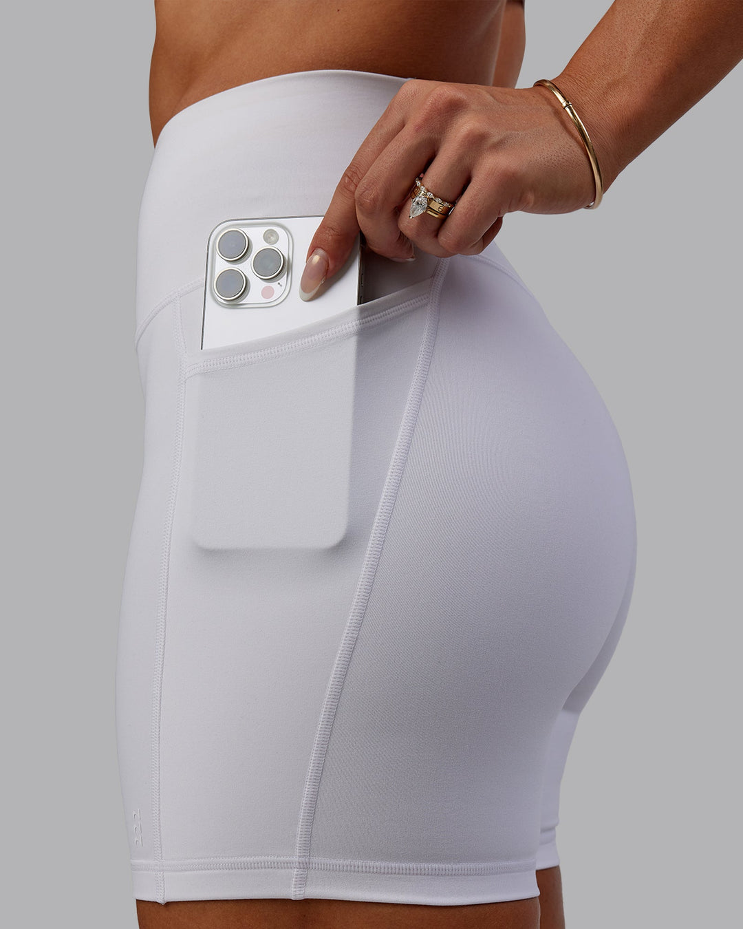 Woman wearing Bree Masters Fusion Ultra High-Rise 6" Short Pockets - White