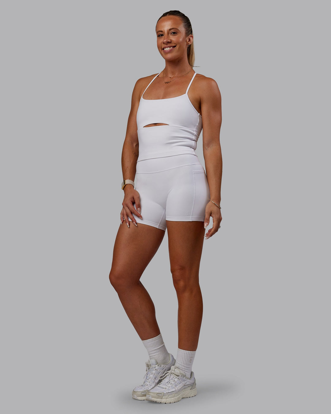 Woman wearing Bree Masters Fusion Ultra High-Rise 4" Short Pockets - White